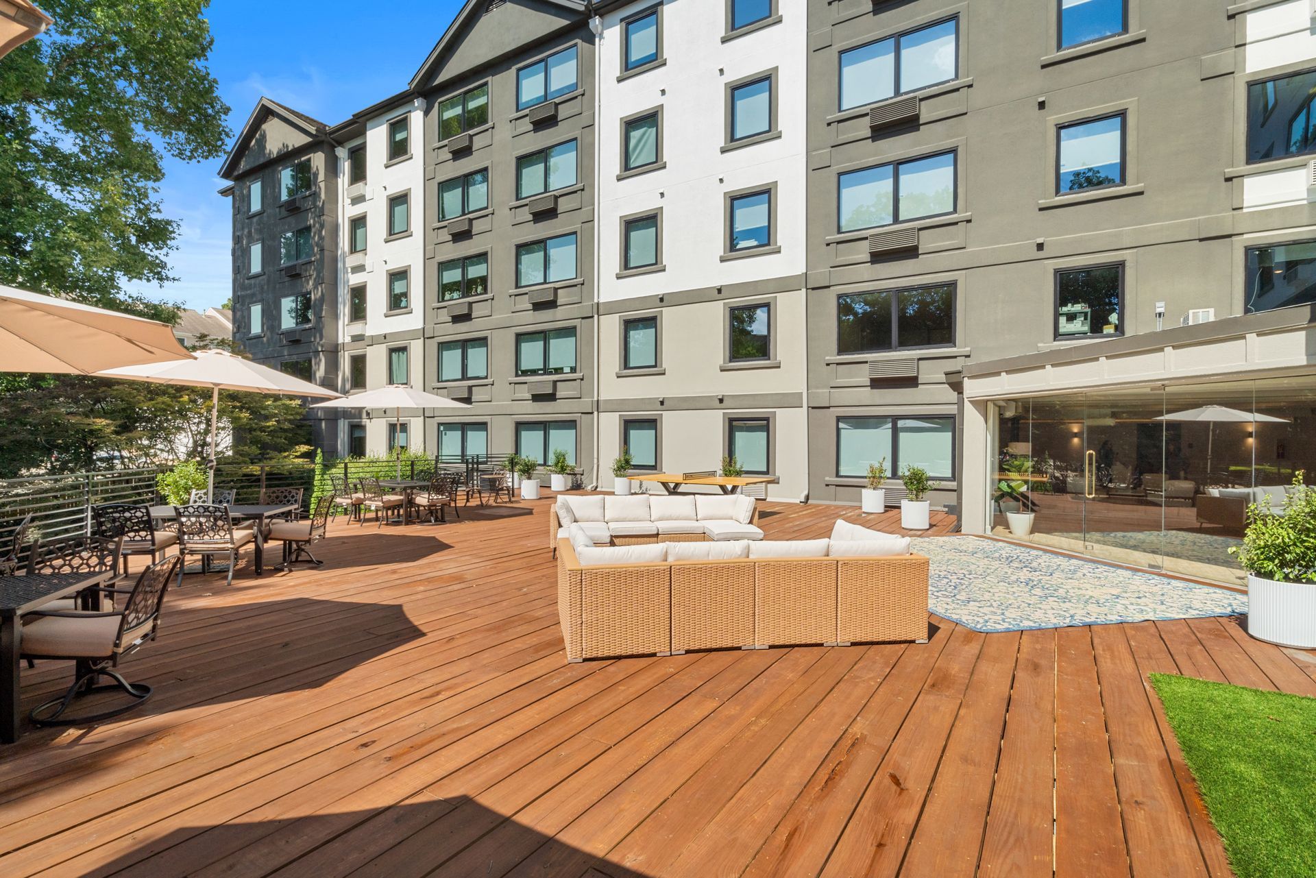 Well-maintained community deck outside at Clairmont Crest senior living apartments in Decatur, GA.