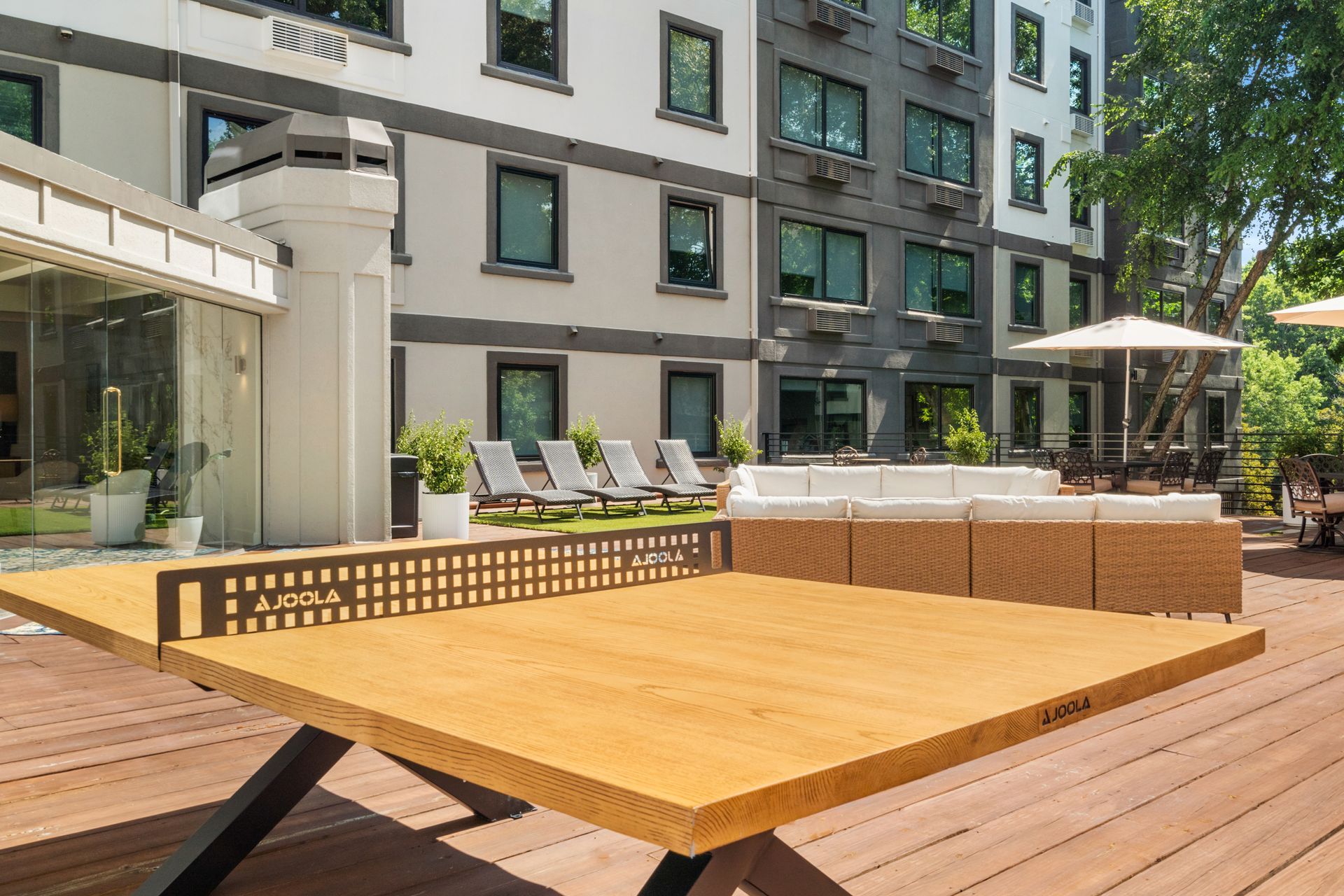 Closeup of the wooden table tennis game at the outdoor lounge area at Clairmont Crest senior living apartments in Decatur, GA.