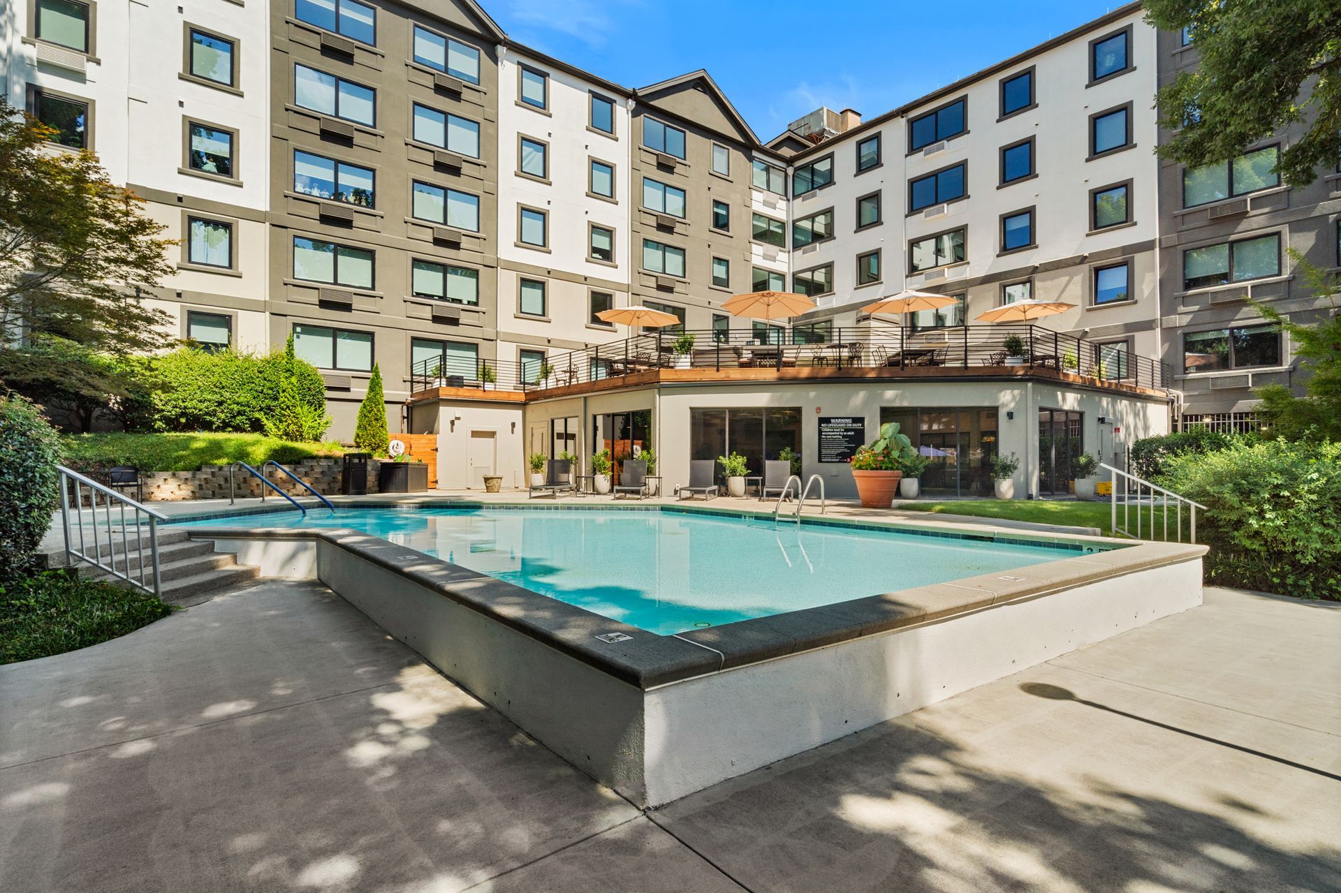 Beautiful day at the outdoor pool at Clairmont Crest senior living apartments in Decatur, GA.