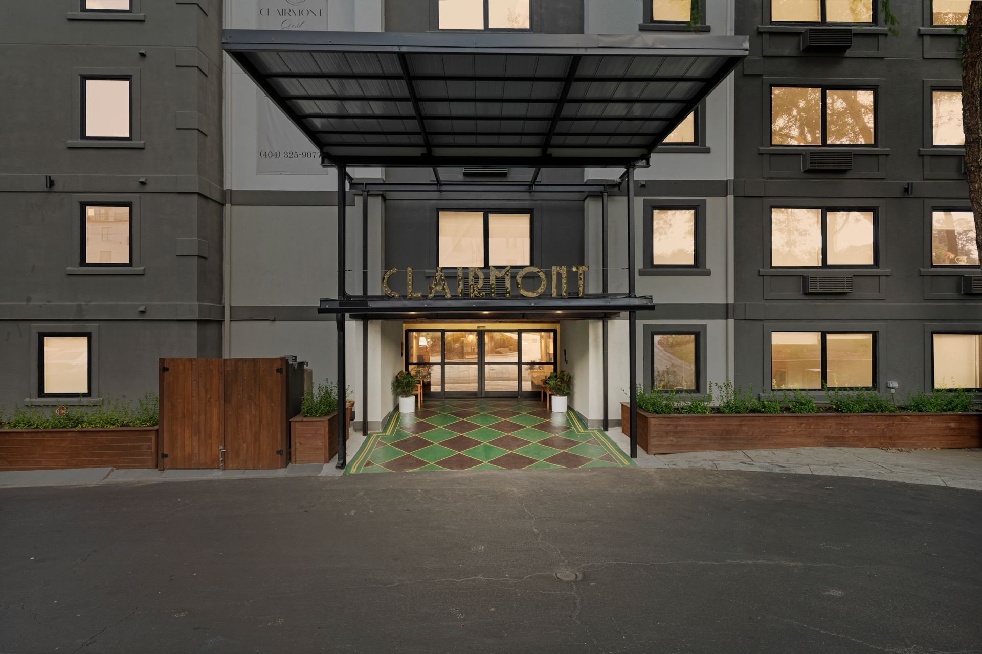 Clean and welcoming exterior entrance to Clairmont Crest senior living apartments in Decatur, GA.