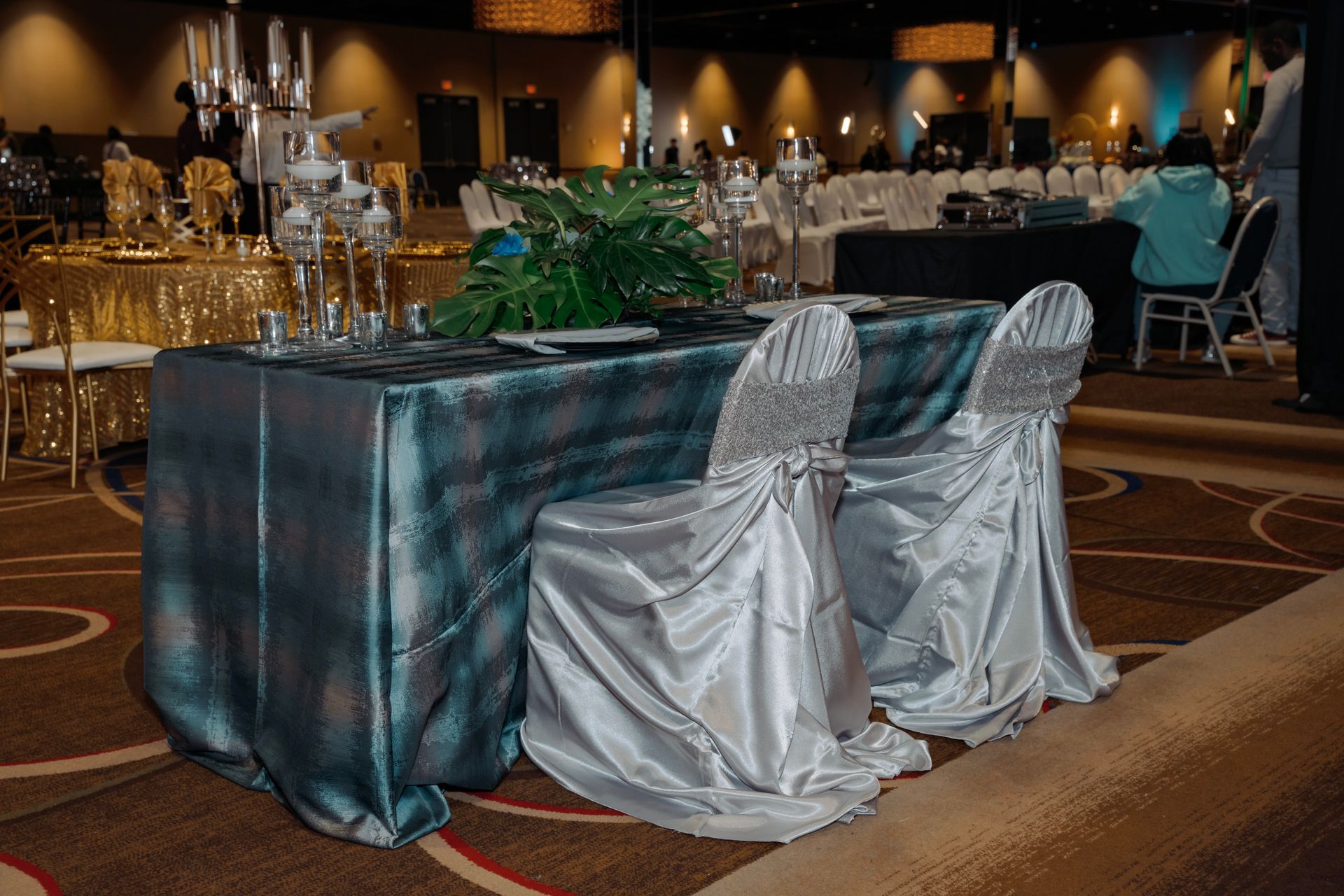 A table and chairs are set up for a wedding reception.
