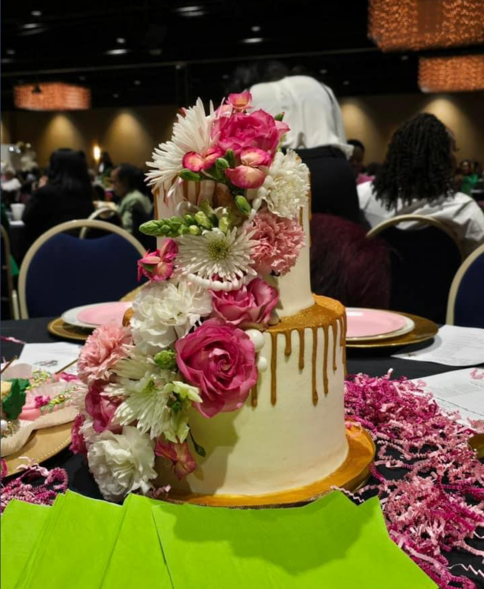 A cake with flowers on it is on a table