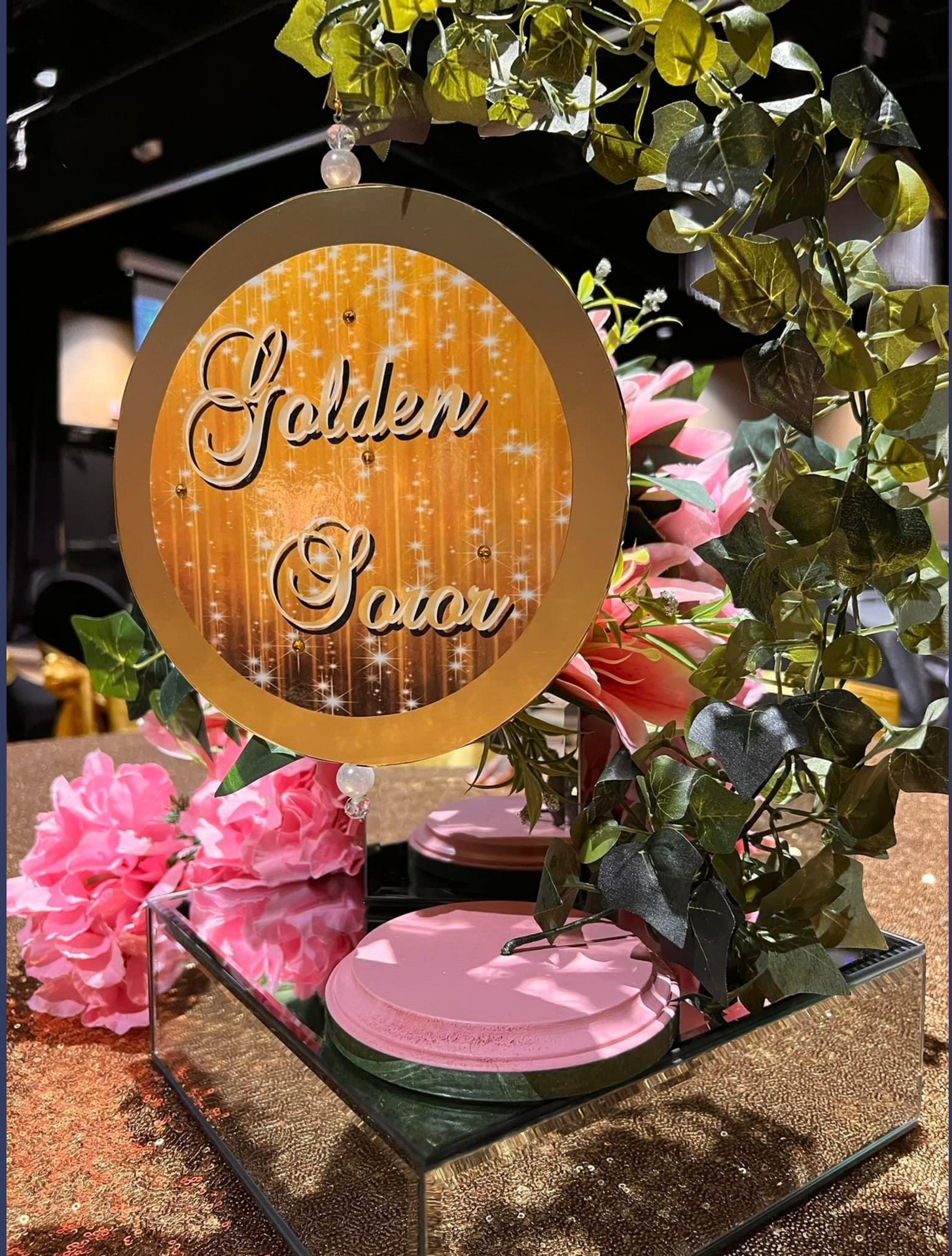A table with flowers and a sign that says 