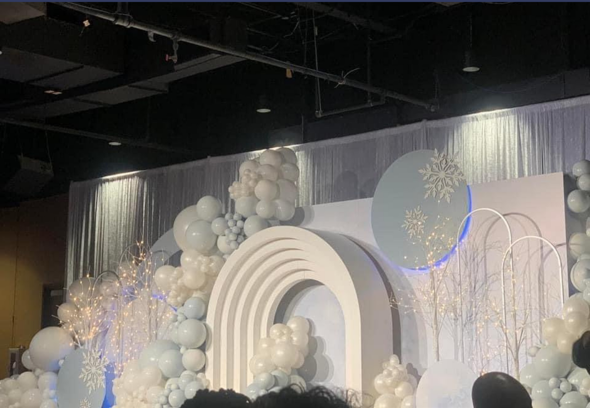 A stage decorated with balloons.