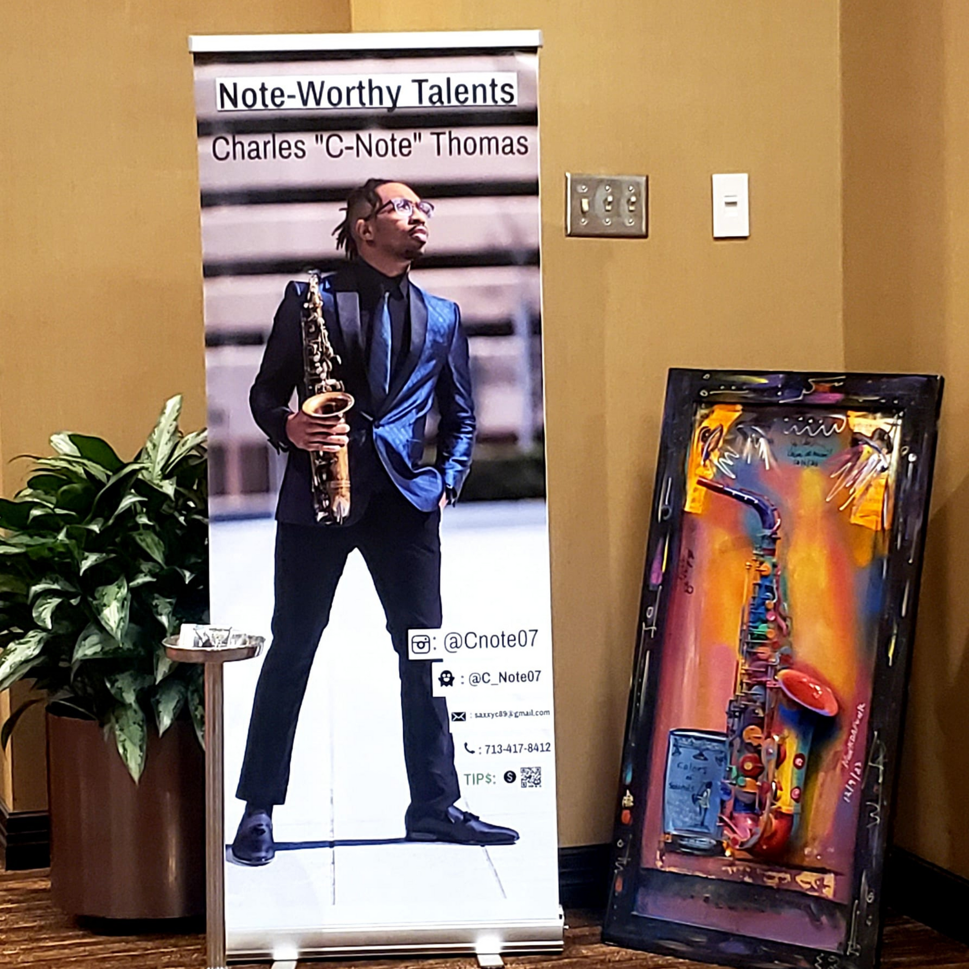 A man holding a saxophone next to a sign that says note-worthy talents