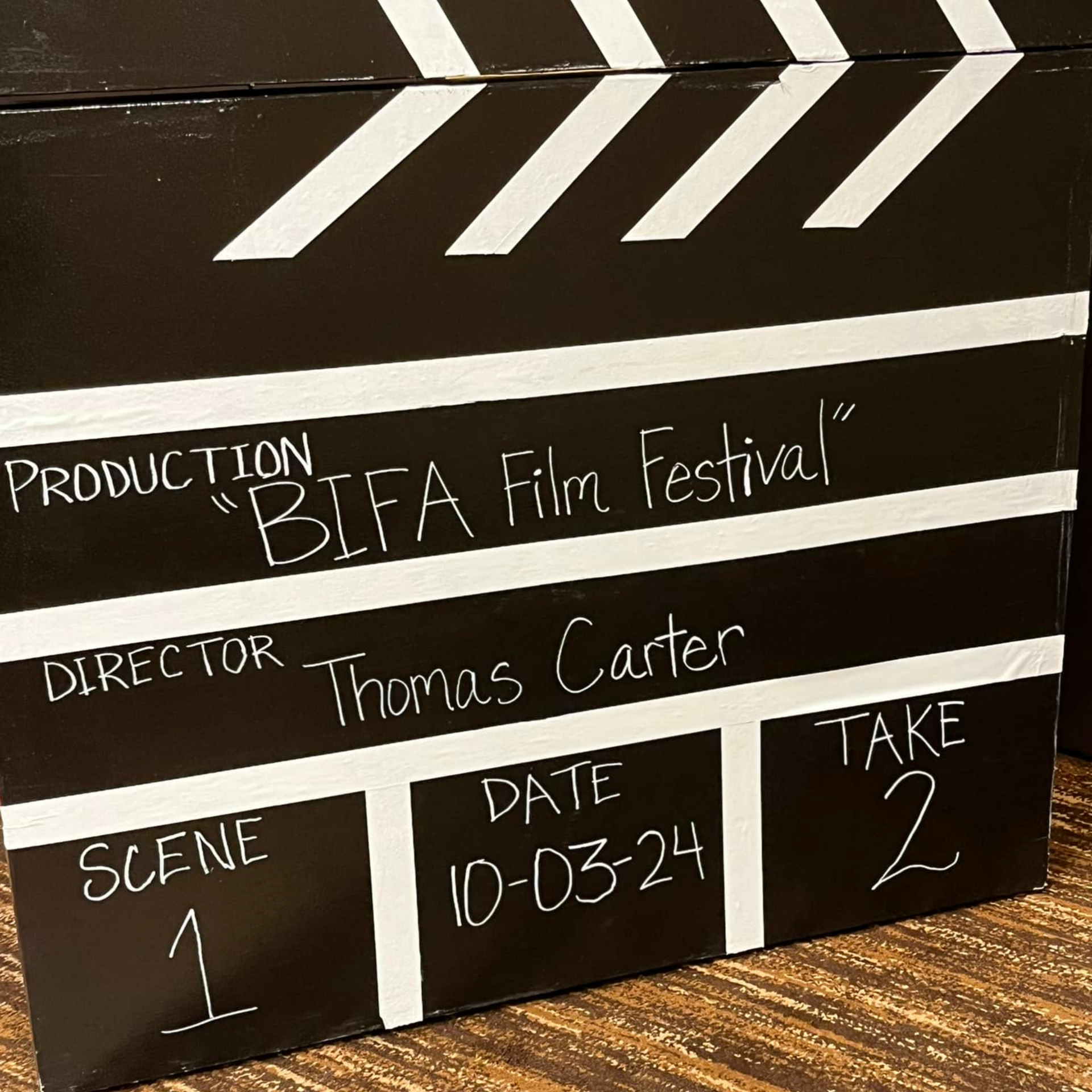 A clapper board that says production bifa film festival