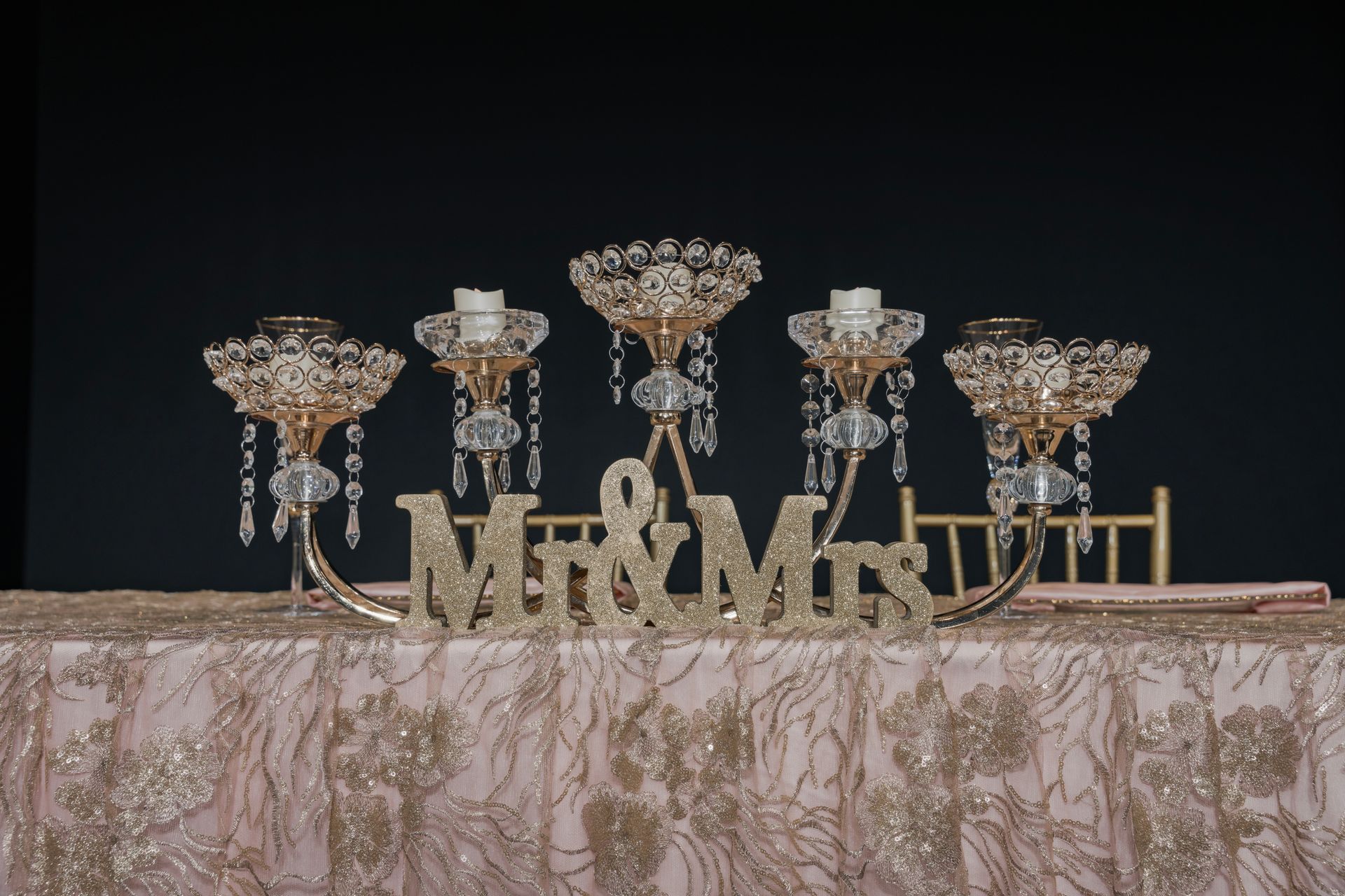 A table with candles and a sign that says mr. and mrs.