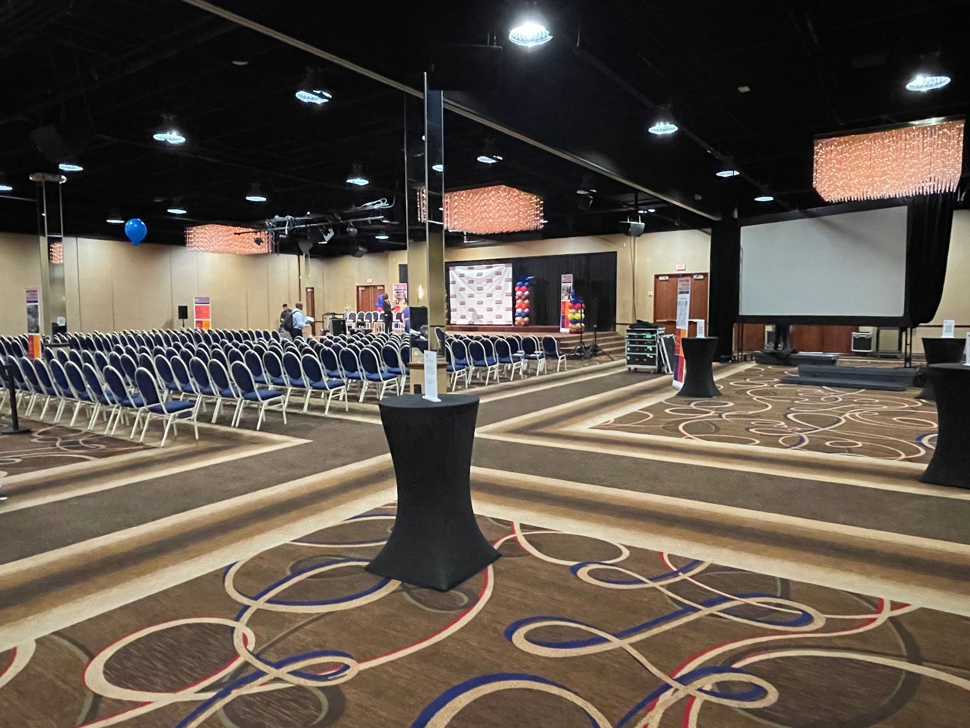 A large room with a lot of chairs and tables