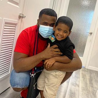 dr ripa and african american man smiling