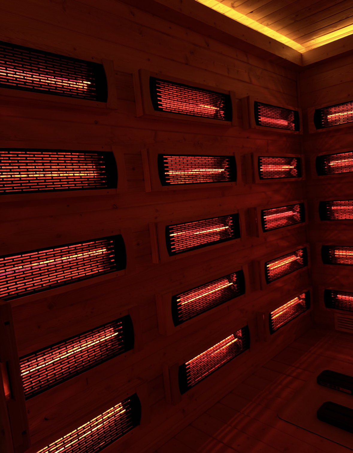 Interior of an infrared sauna with glowing red heating panels on the walls.