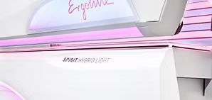 Close-up of a white tanning bed with the words