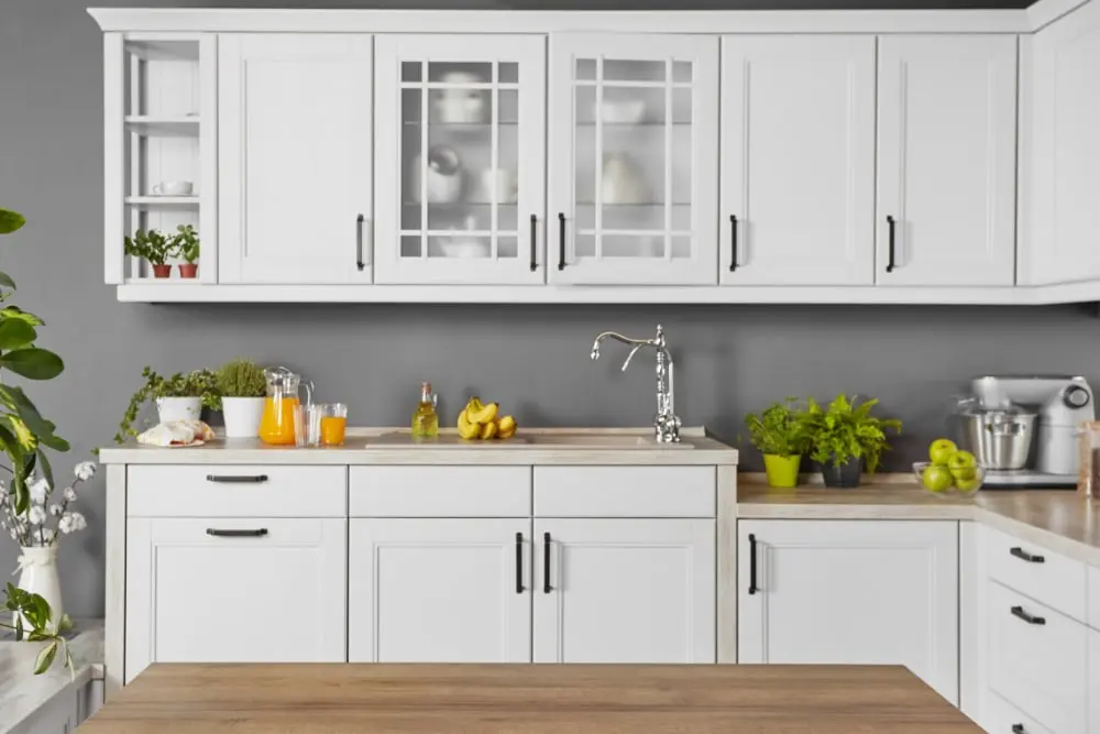 A Kitchen With White Cabinets and a Wooden Counter Top — Dynamic 2-Pack In Rockville, QLD