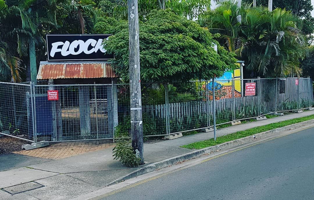 Building With a Sign That Says Flock on It is Behind a Fence — Safety Fence Australia in Middle Pocket, NSW