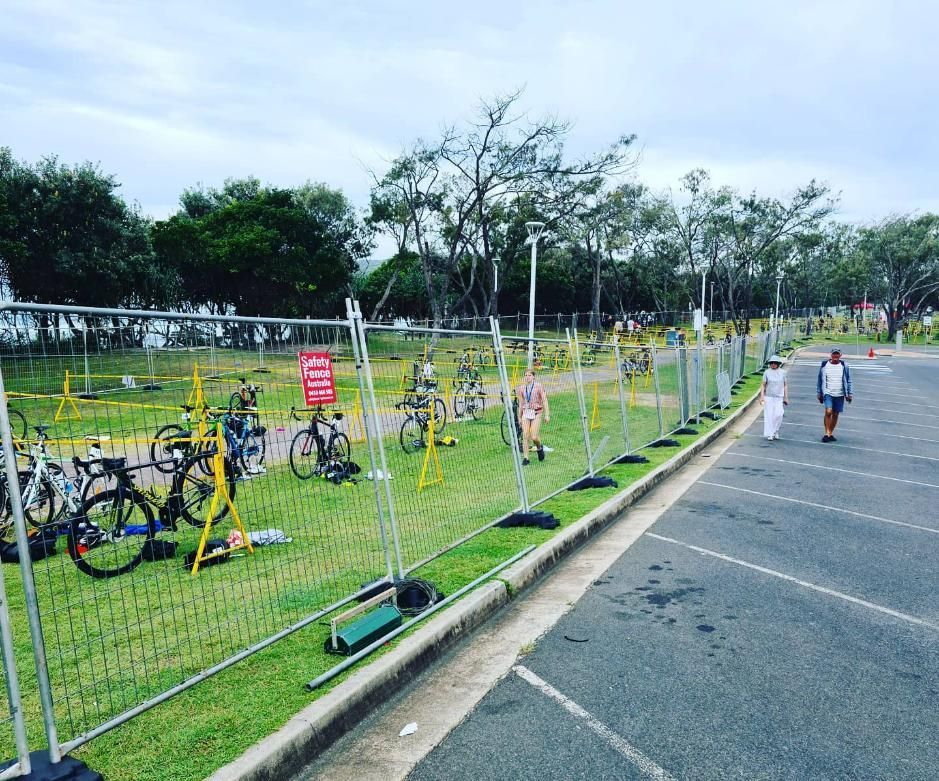 Bunch of Bikes Are Parked in a Grassy Area Behind a Fence — Safety Fence Australia in Pottsville, NSW