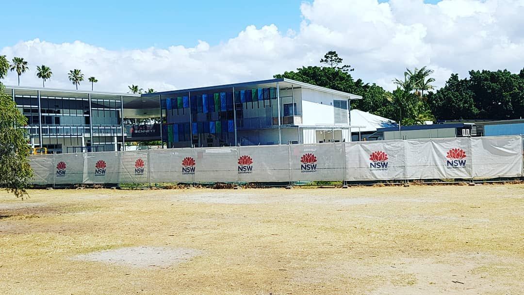 Large Building is Being Built in a Field Behind a Fence — Safety Fence Australia in Mullumbimby, NSW