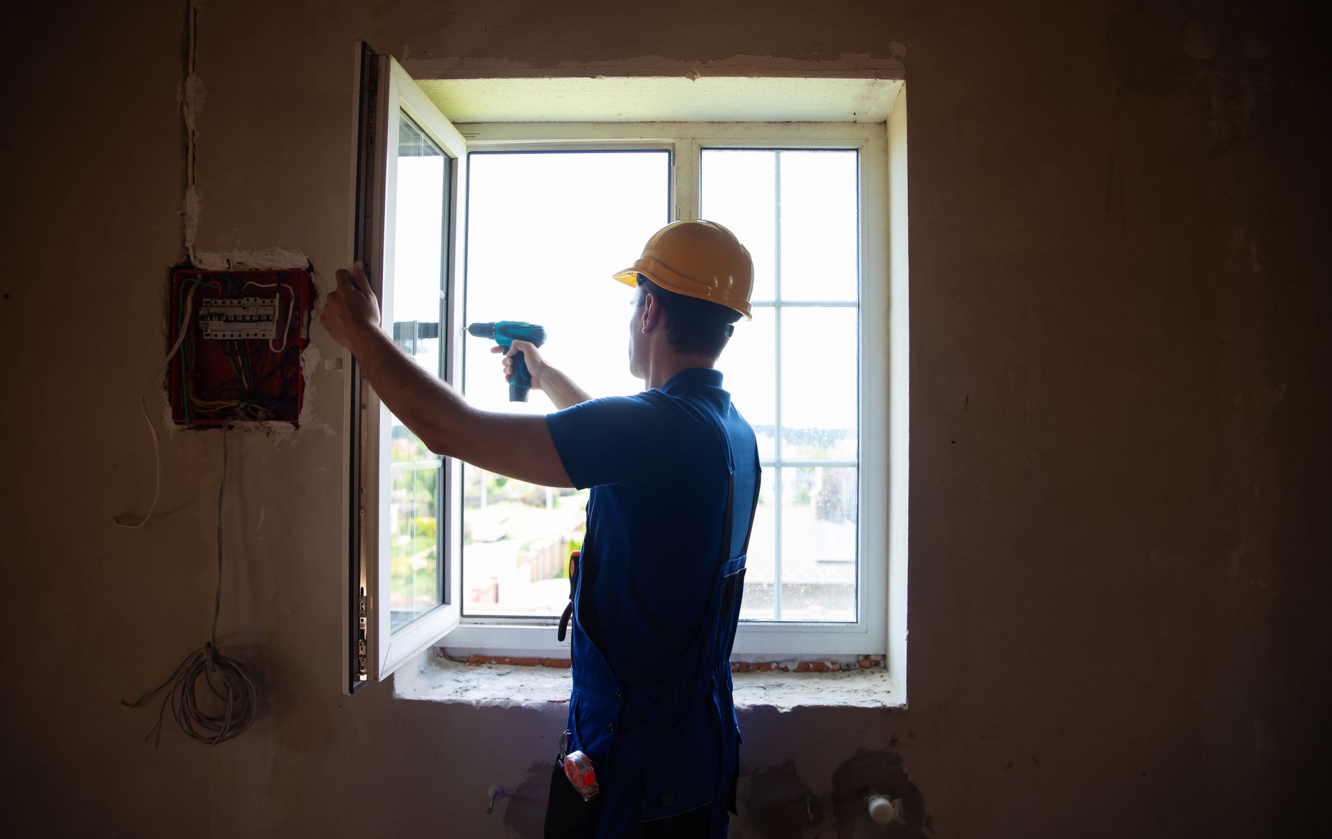 Worker installing a window.