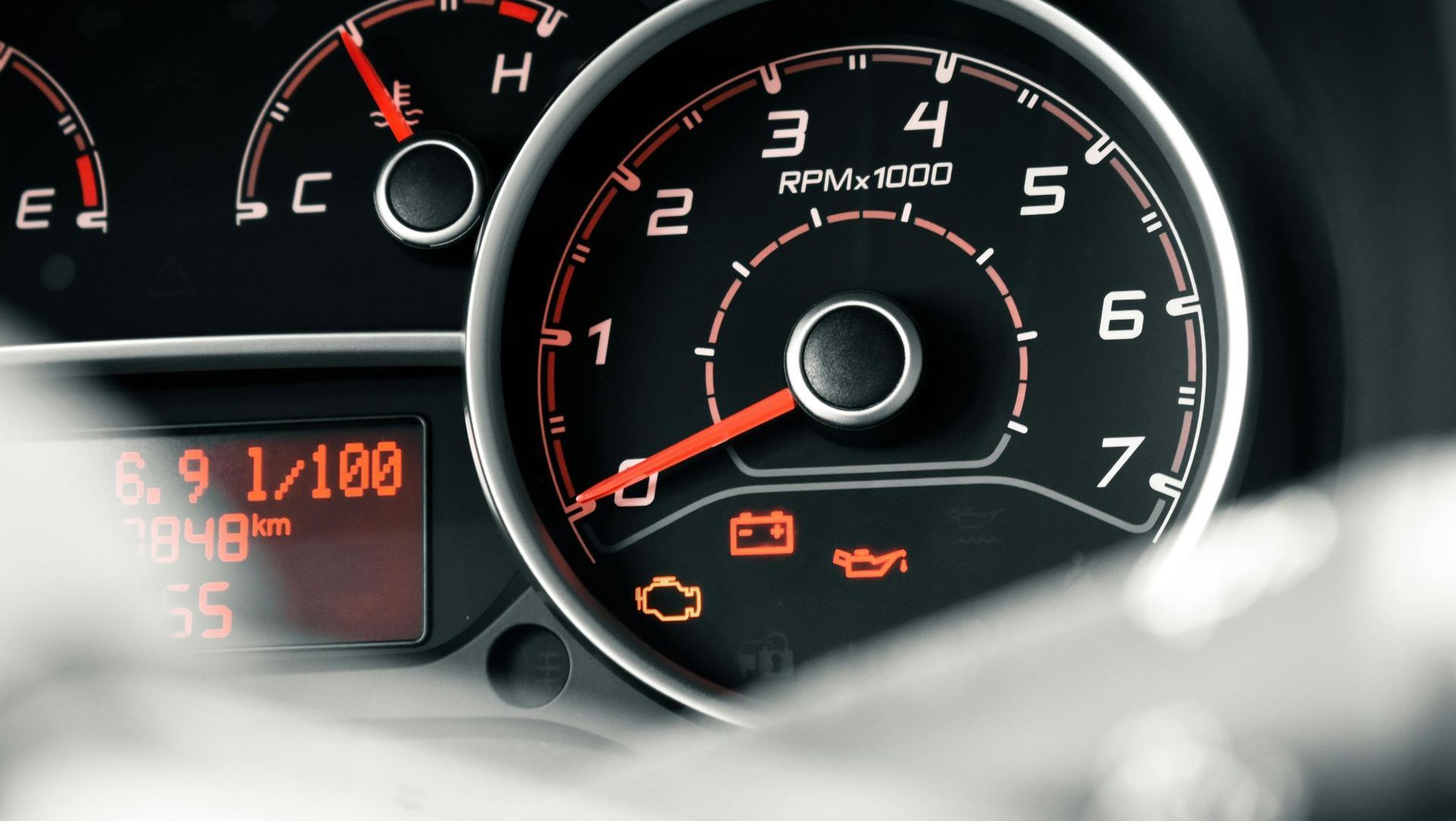 Car dashboard with engine warning lights