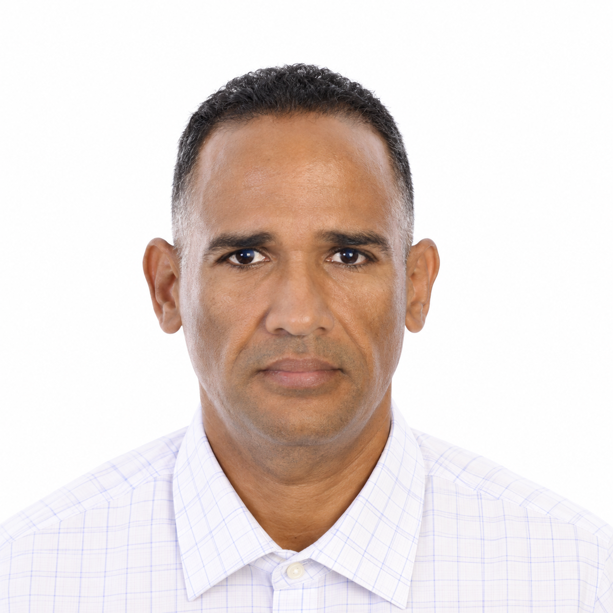 Studio headshot of a man in a white collared shirt on a plain white background