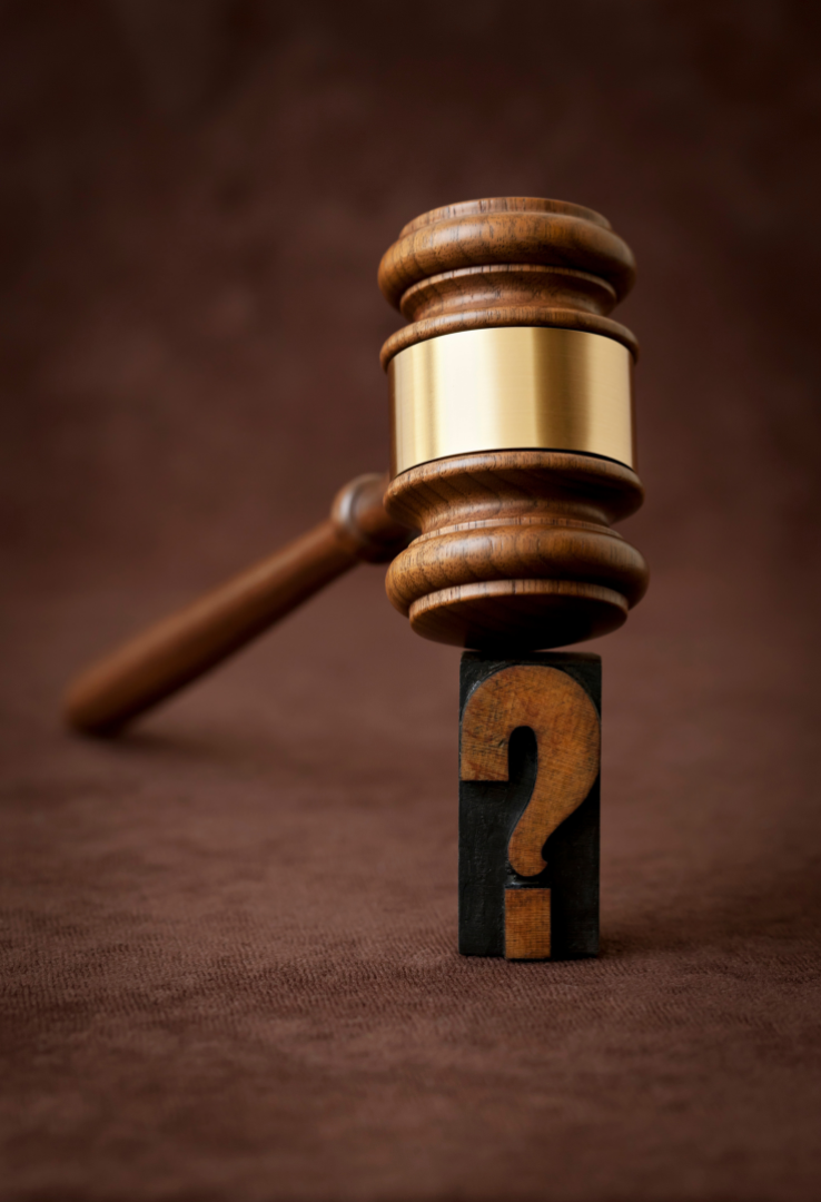 Get more answers at our FAQ page. Judge’s gavel resting on a question-mark block, symbolizing uncertainty or a legal decision