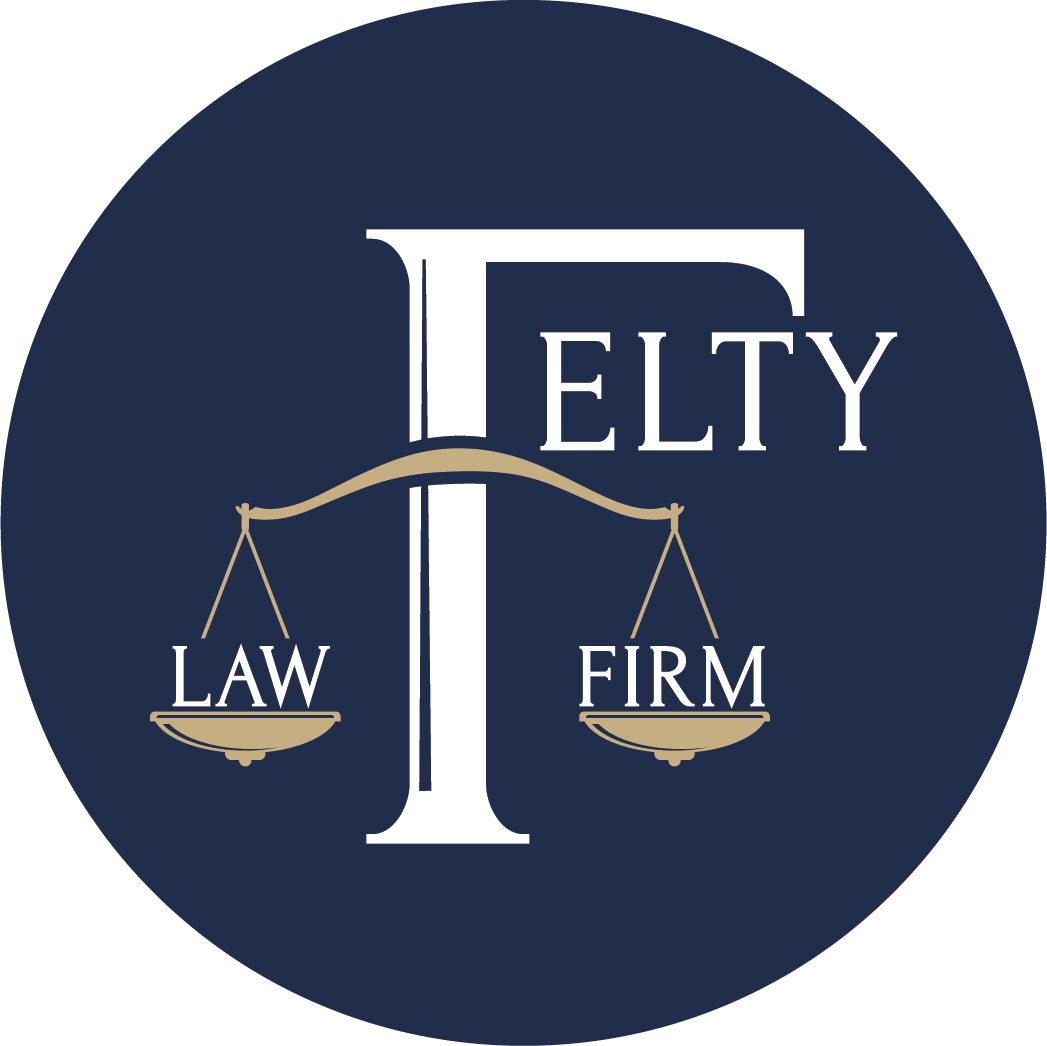 Dark blue circular logo for Delty Law Firm with gold scales and white serif lettering
