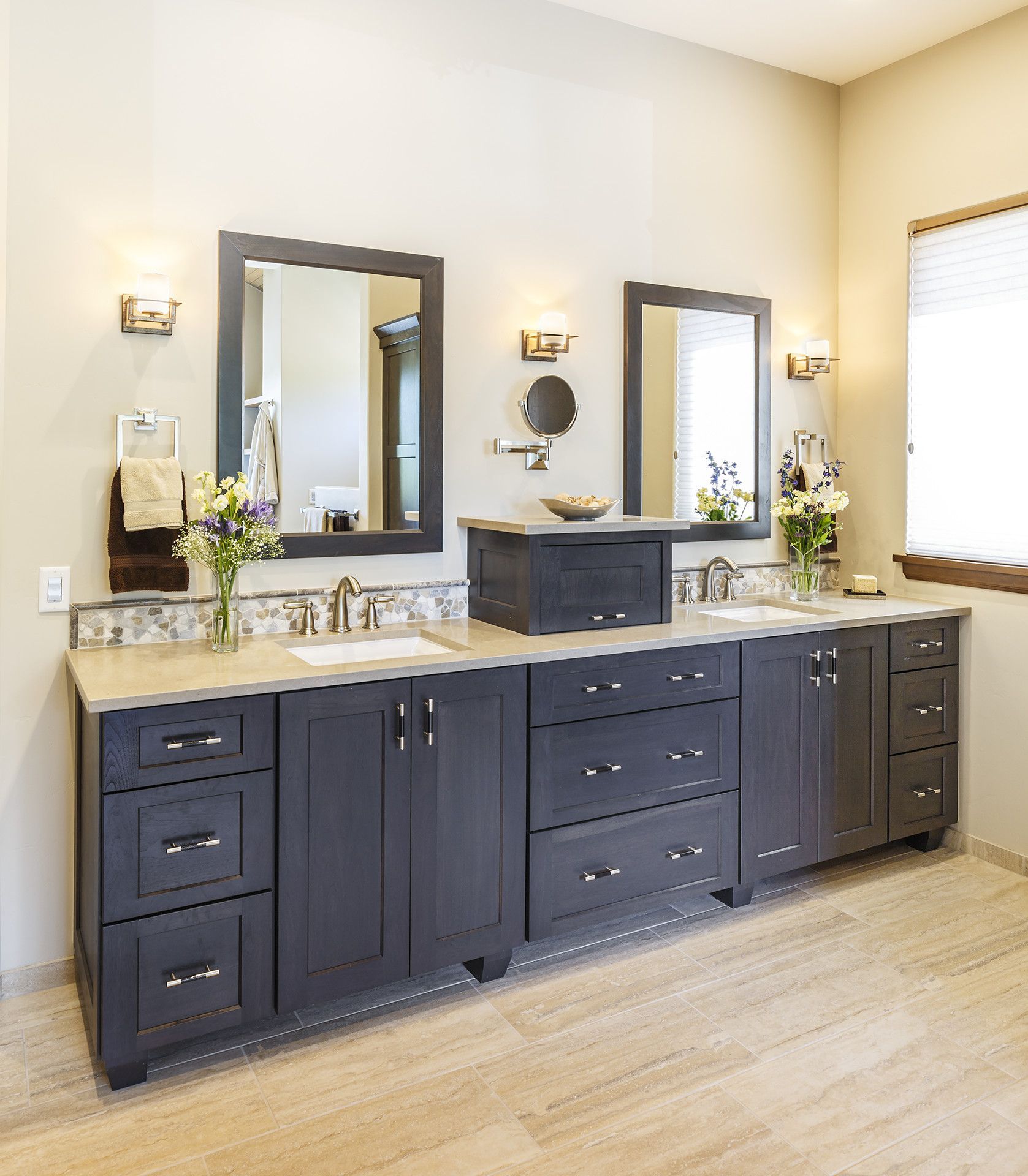 A bathroom with two sinks and two mirrors