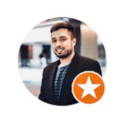 a man in a suit is standing in a circle with an orange star .