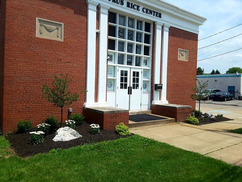 Brick building with white pillars and 
