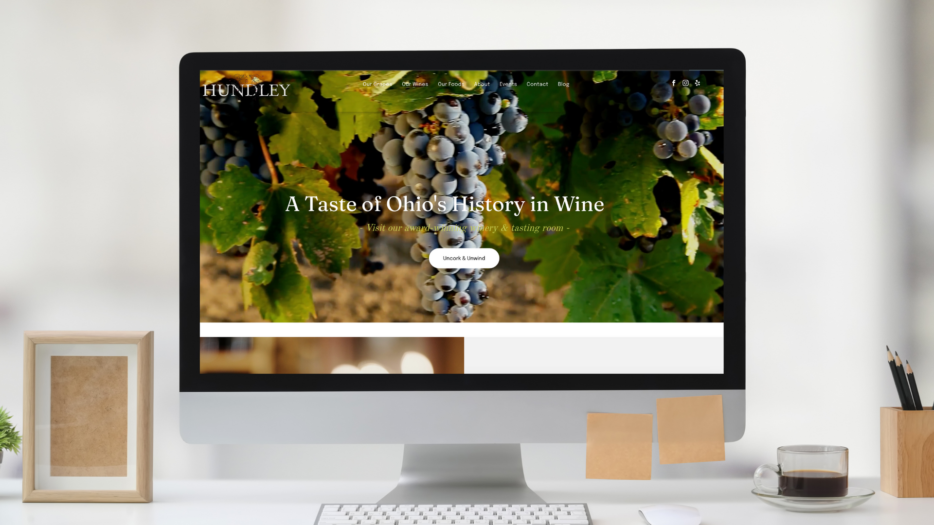 A computer monitor is displaying a website for a winery.