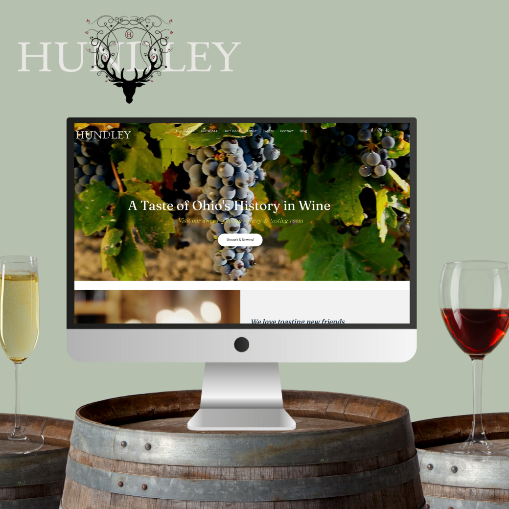 A computer monitor displays the website for humbley winery