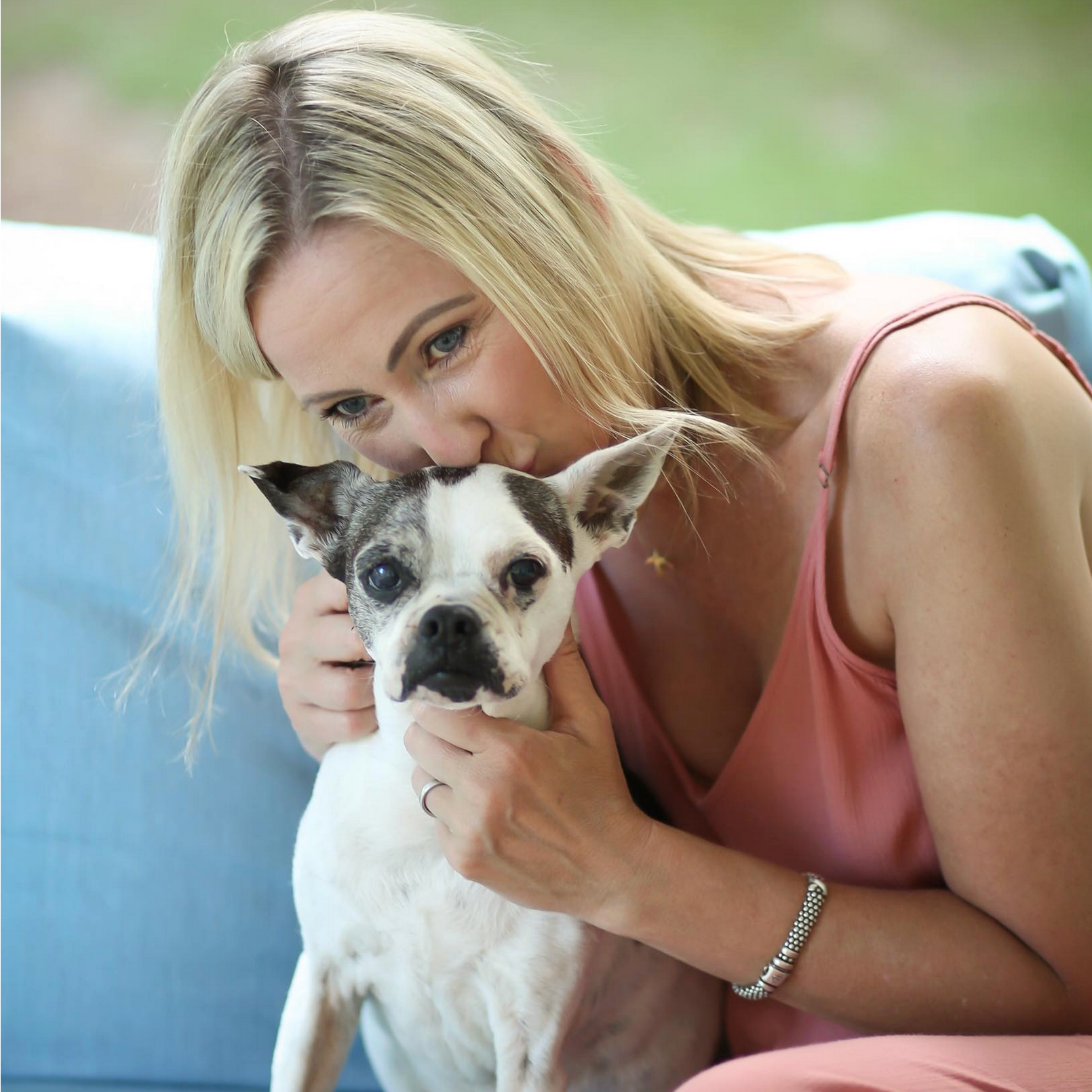 Woman business owner with her dog featured in Octo Strategies' Women Owned Businesses spotlight