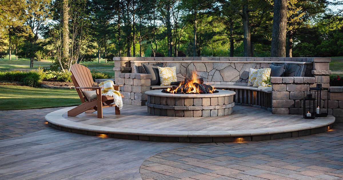 There is a fire pit in the middle of the patio.