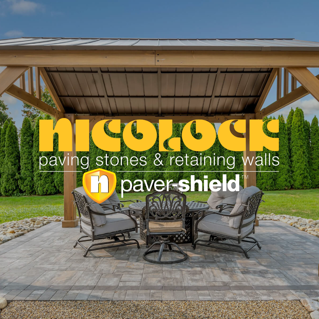 A patio with a table and chairs under a gazebo with the words nicolock paving stones and retaining walls