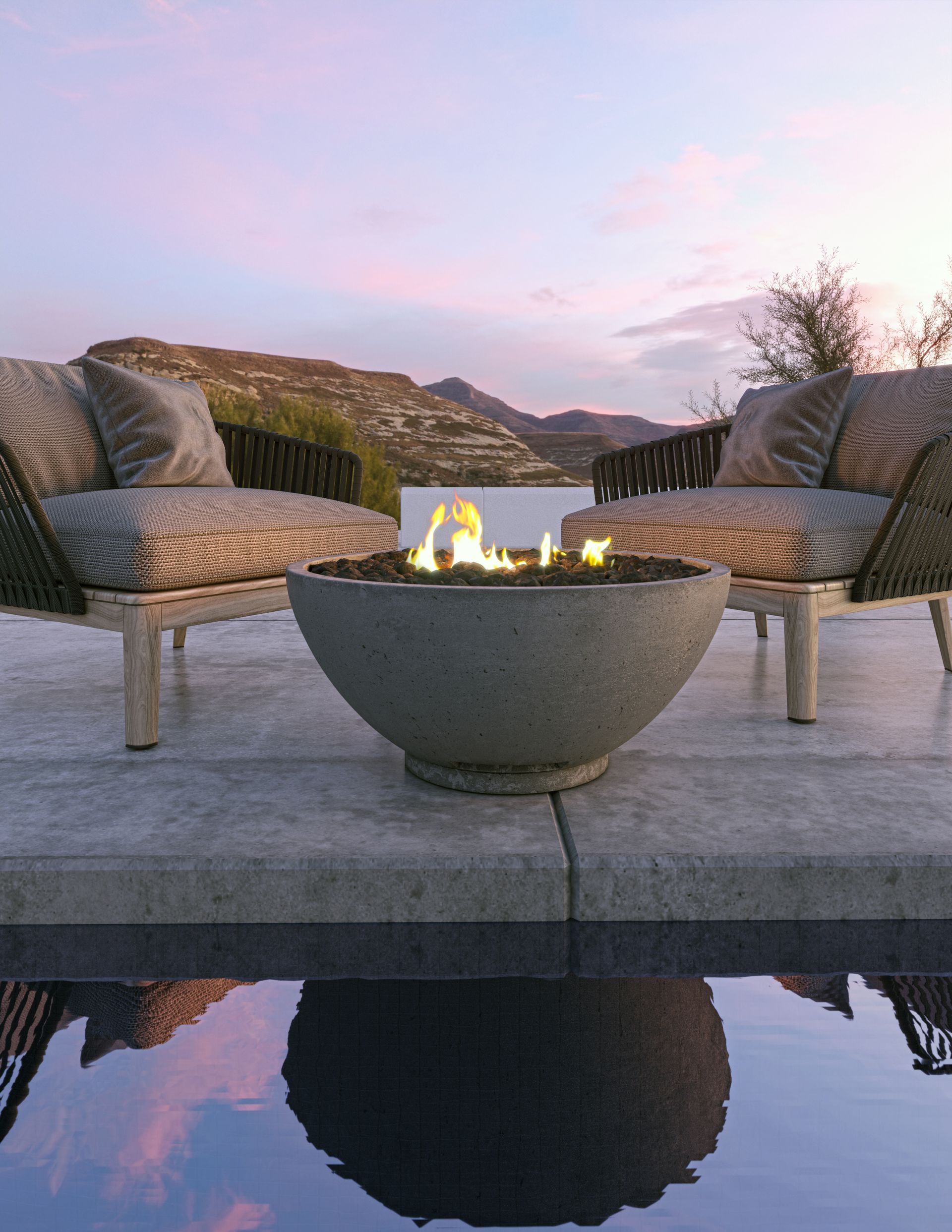 Two chairs are sitting next to a fire pit on a patio.