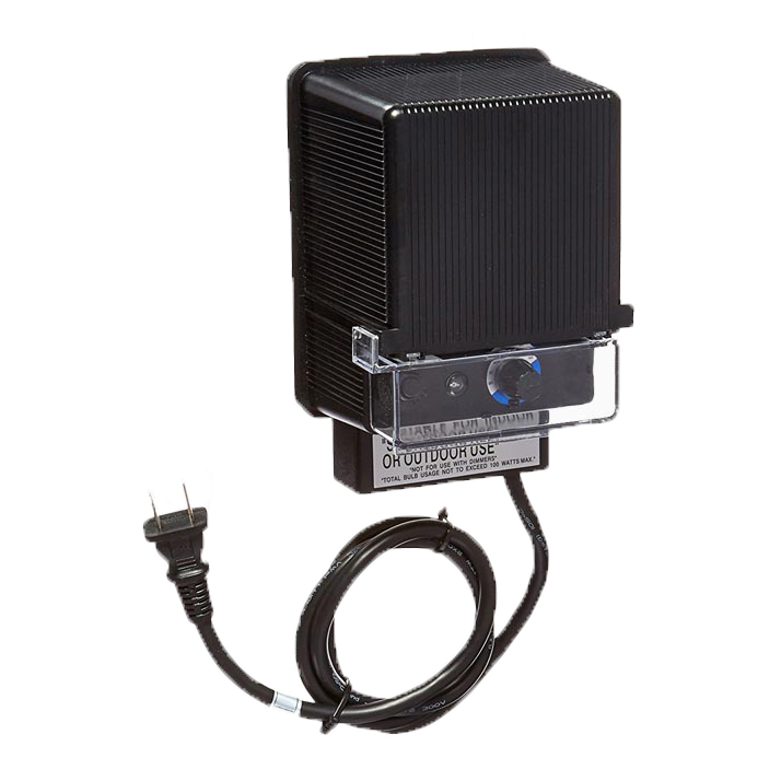 A black transformer with a cord attached to it on a white background.
