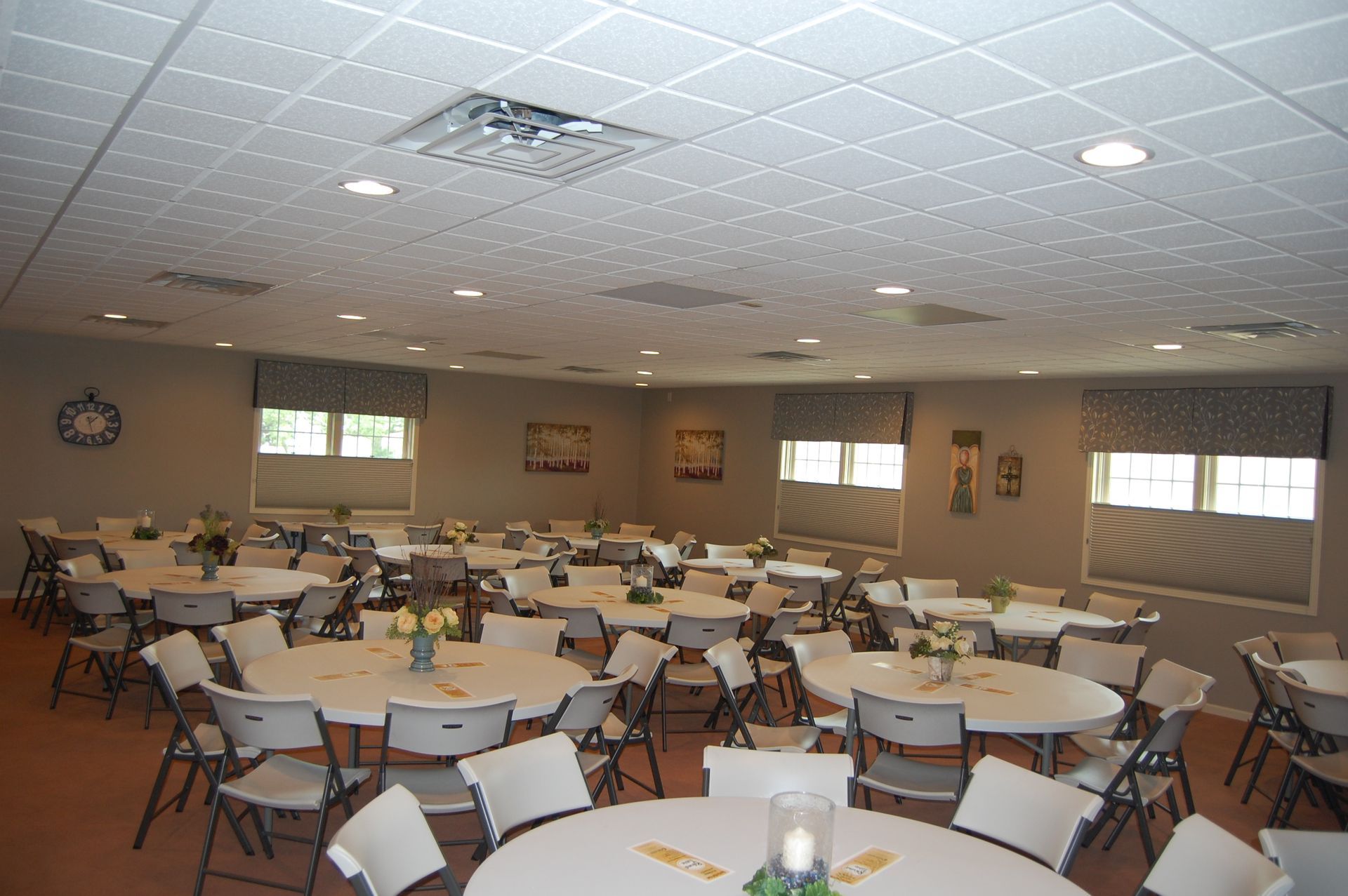 A large room with lots of tables and chairs