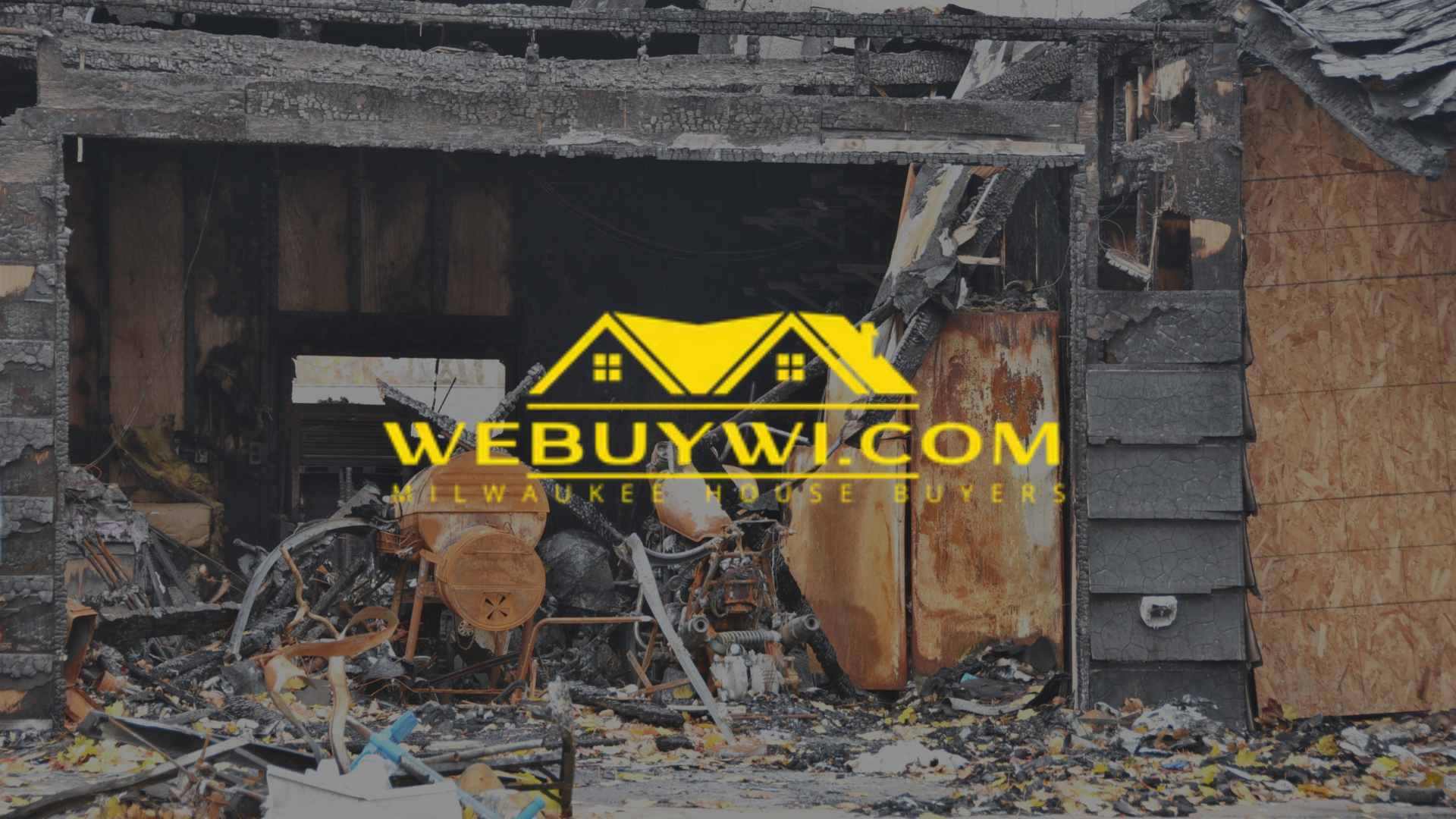 Fire-damaged house exterior; charred wood, debris, and burnt interior visible.