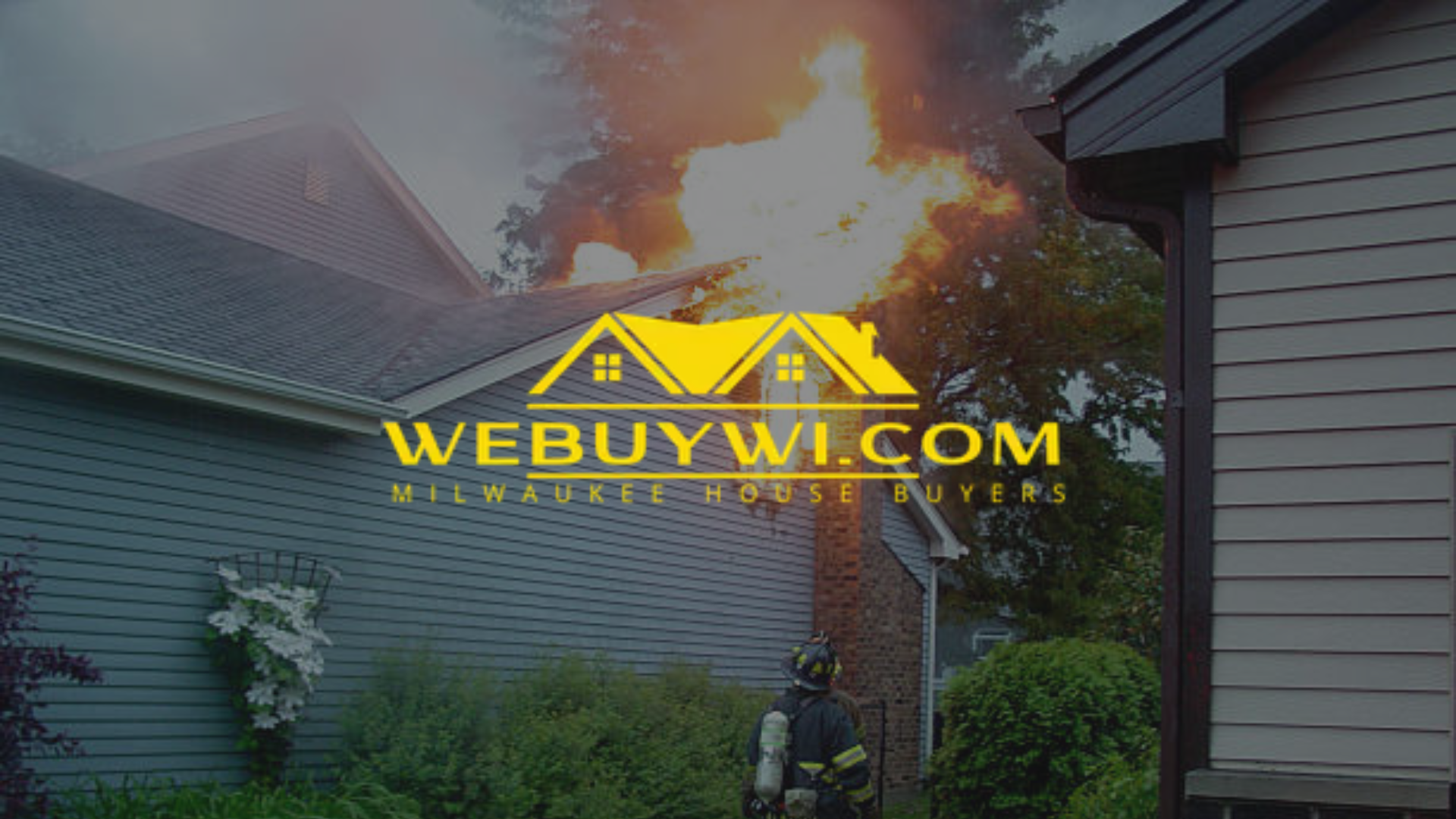 A house on fire with the website WEBUYWI.COM superimposed. A firefighter is visible in the foreground.