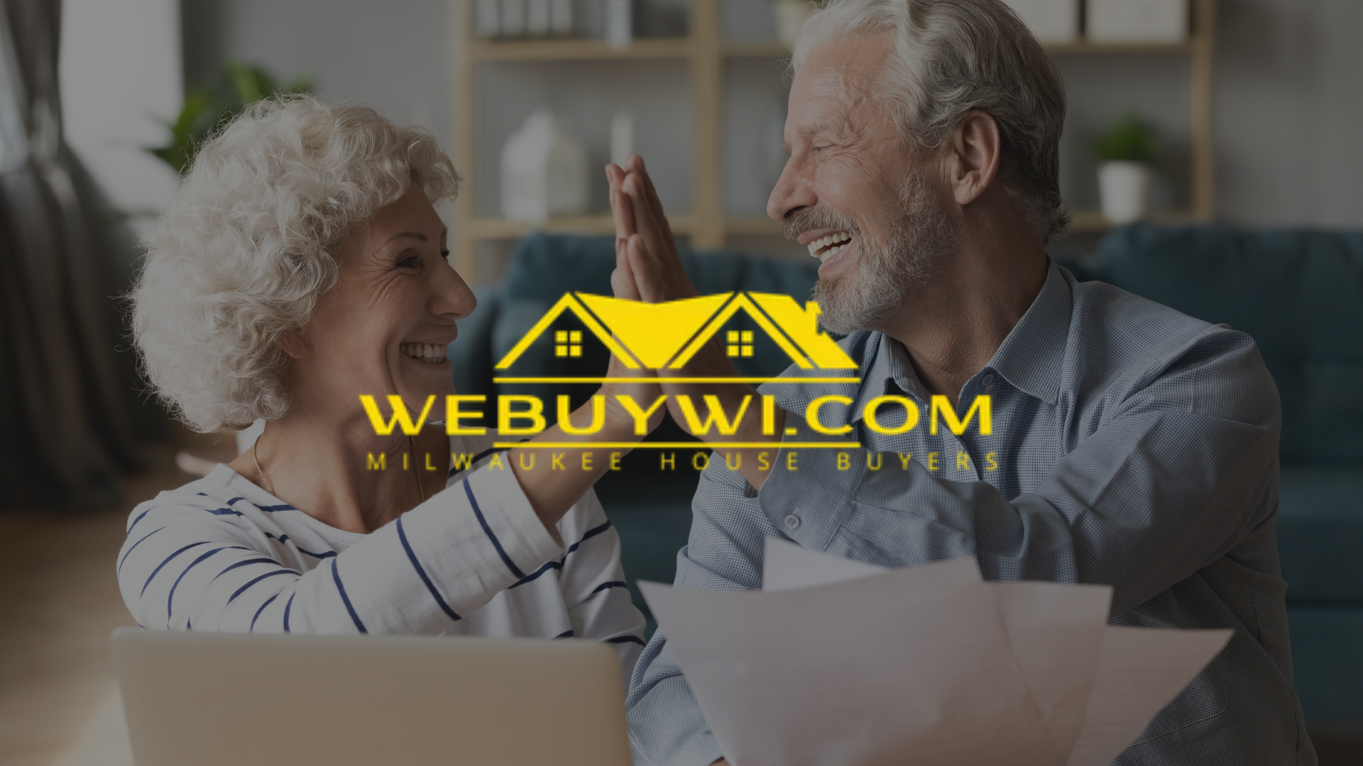 Smiling couple giving a high five, with paperwork and laptop. Website logo overlayed: WEBUYWI.COM, Milwaukee house buyer.
