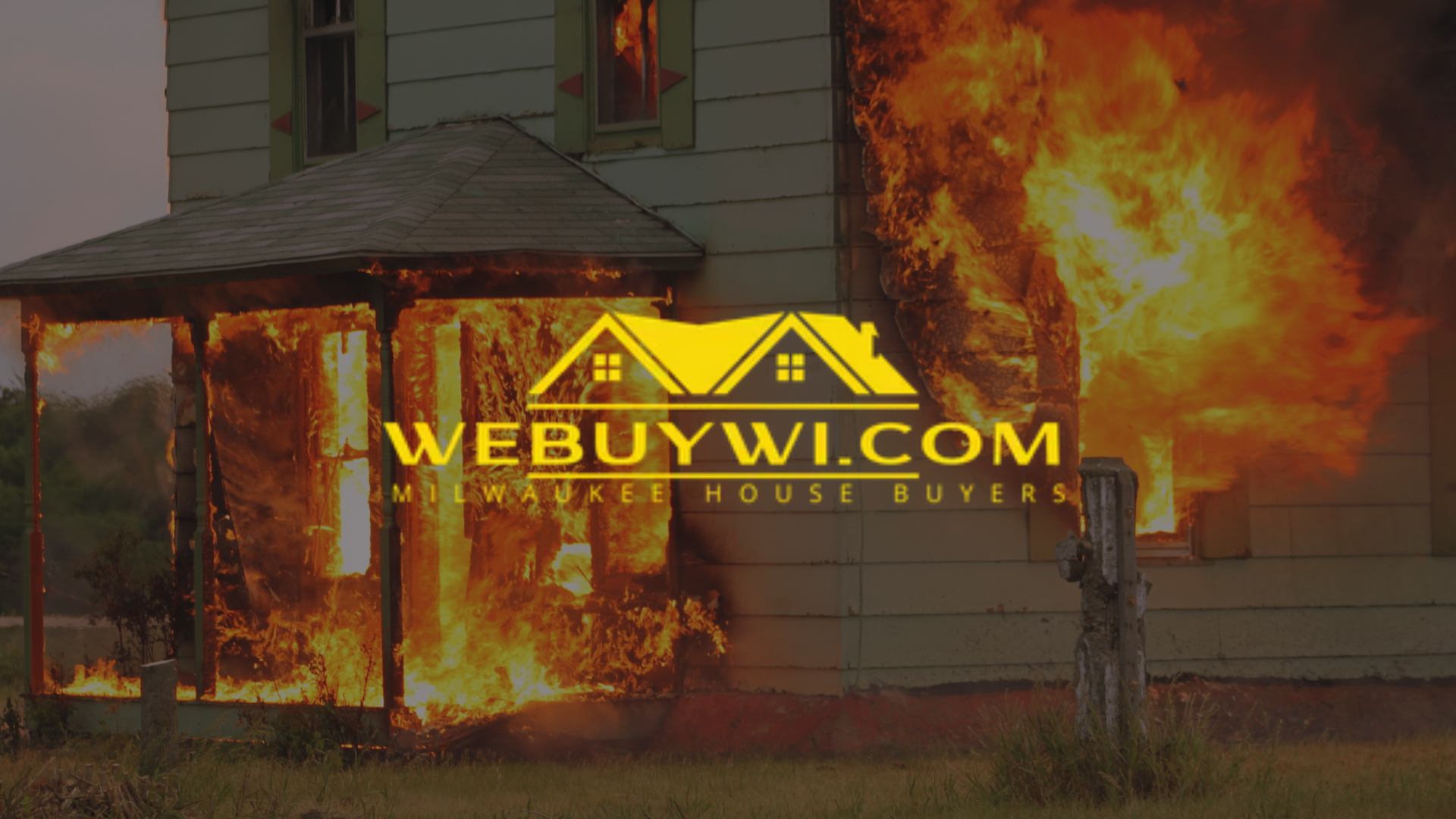 House on fire, with flames engulfing the porch and side.