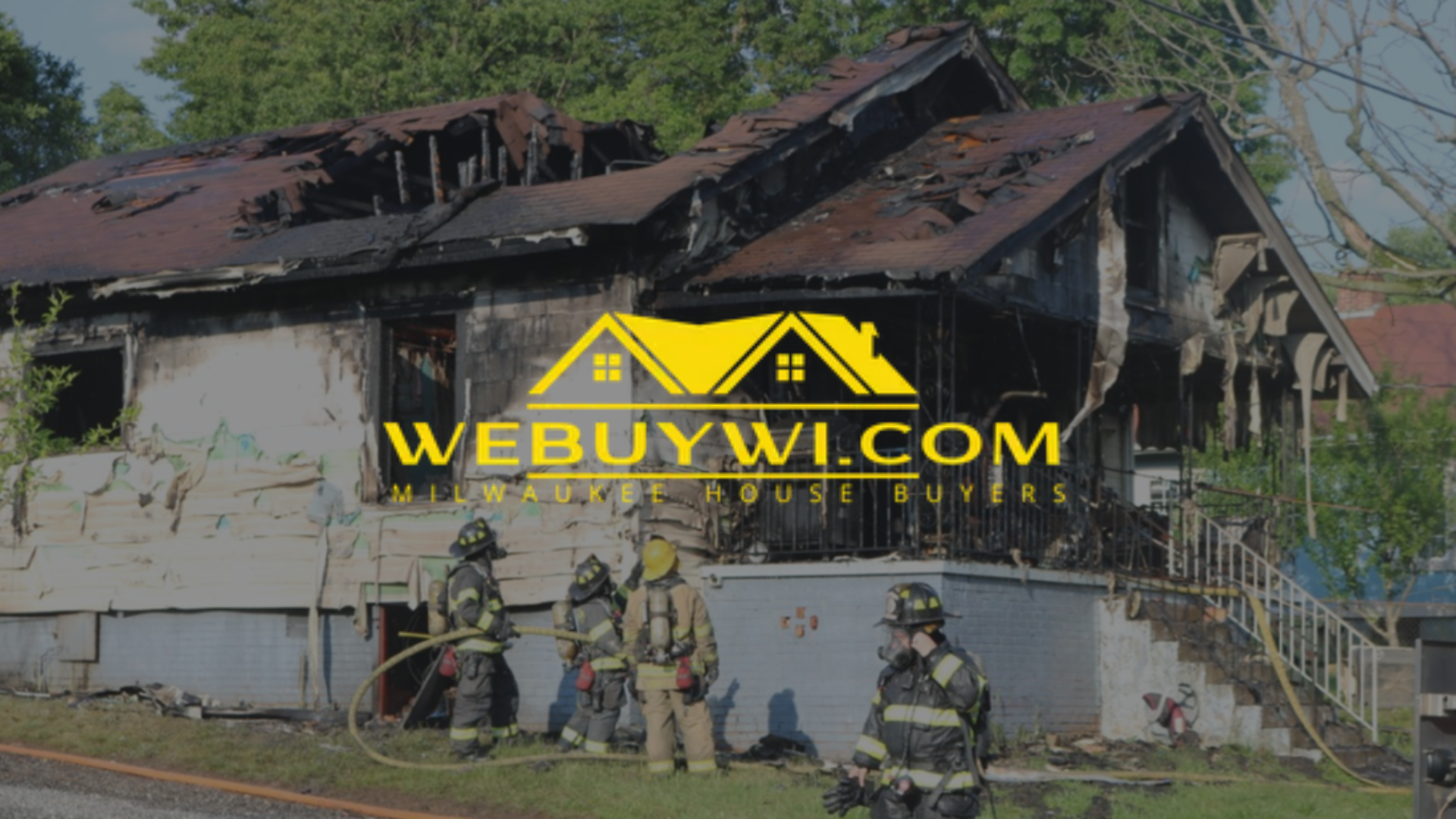 A house on fire with the website WEBUYWI.COM superimposed. A firefighter is visible in the foreground.