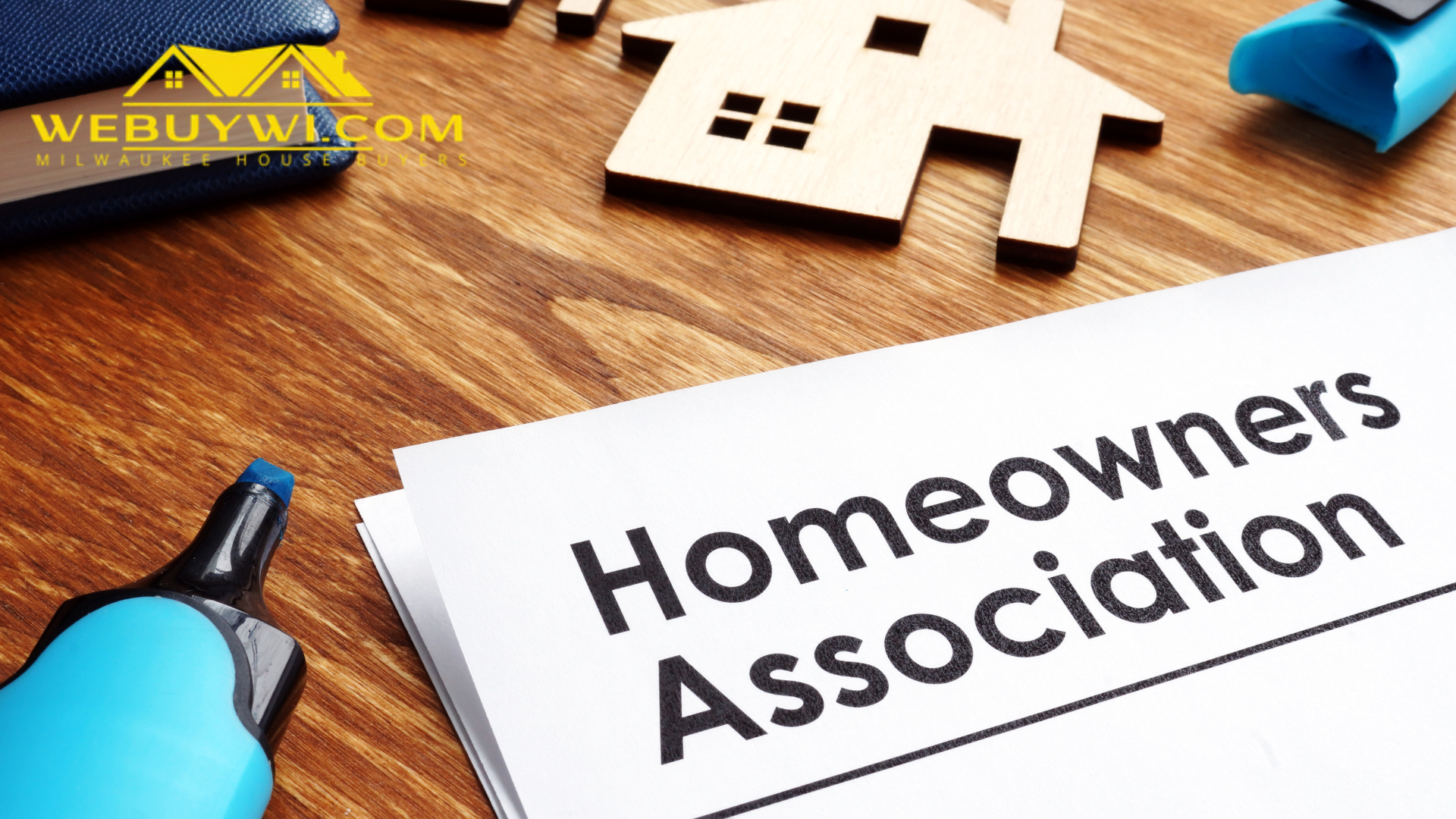 A piece of paper with the words `` homeowners association '' written on it is sitting on a wooden table.