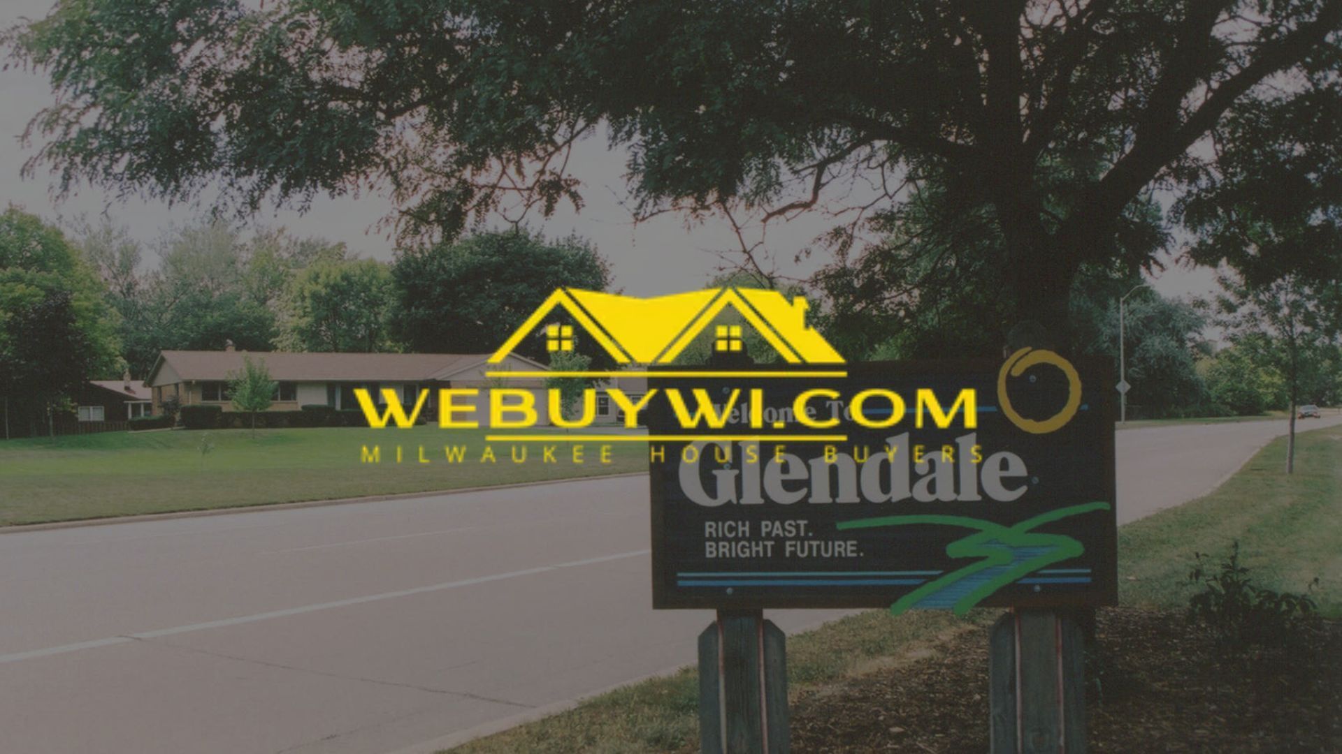 Sign for Glendale, WI next to a road, with