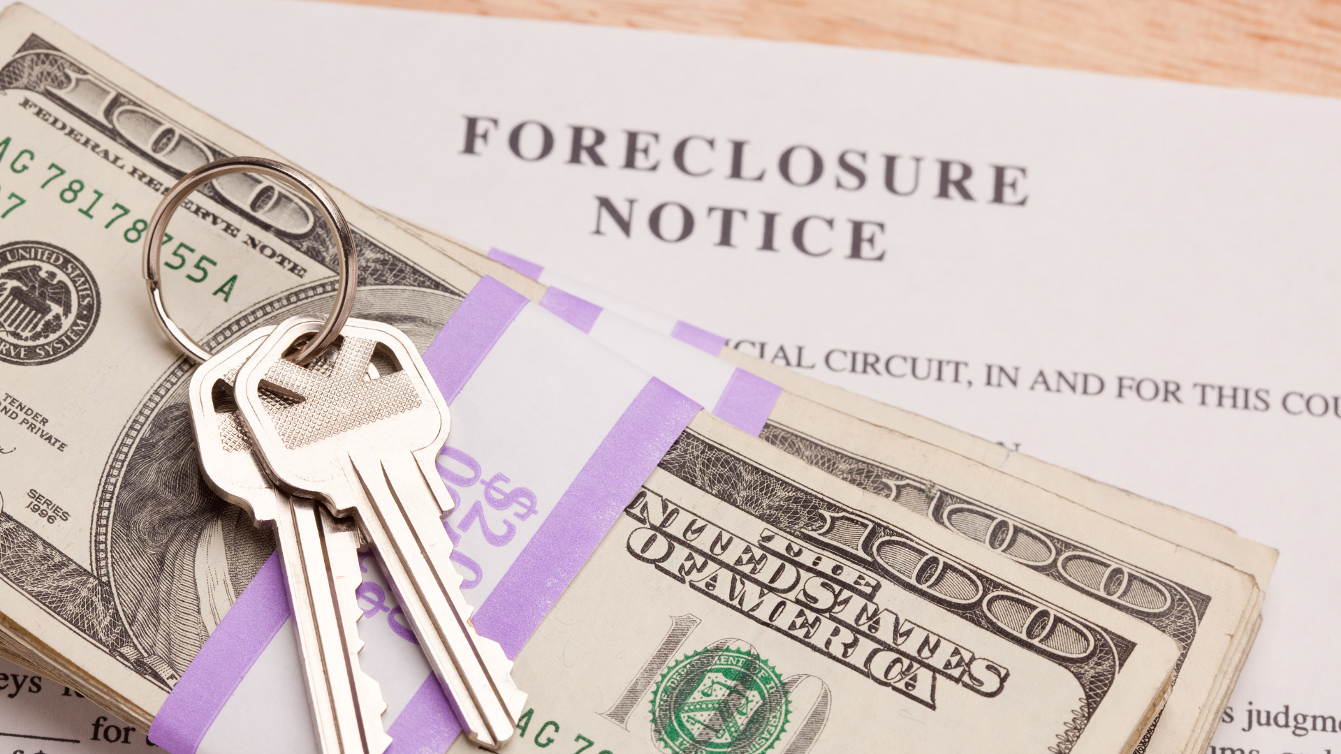 A foreclosure notice with keys and money on it