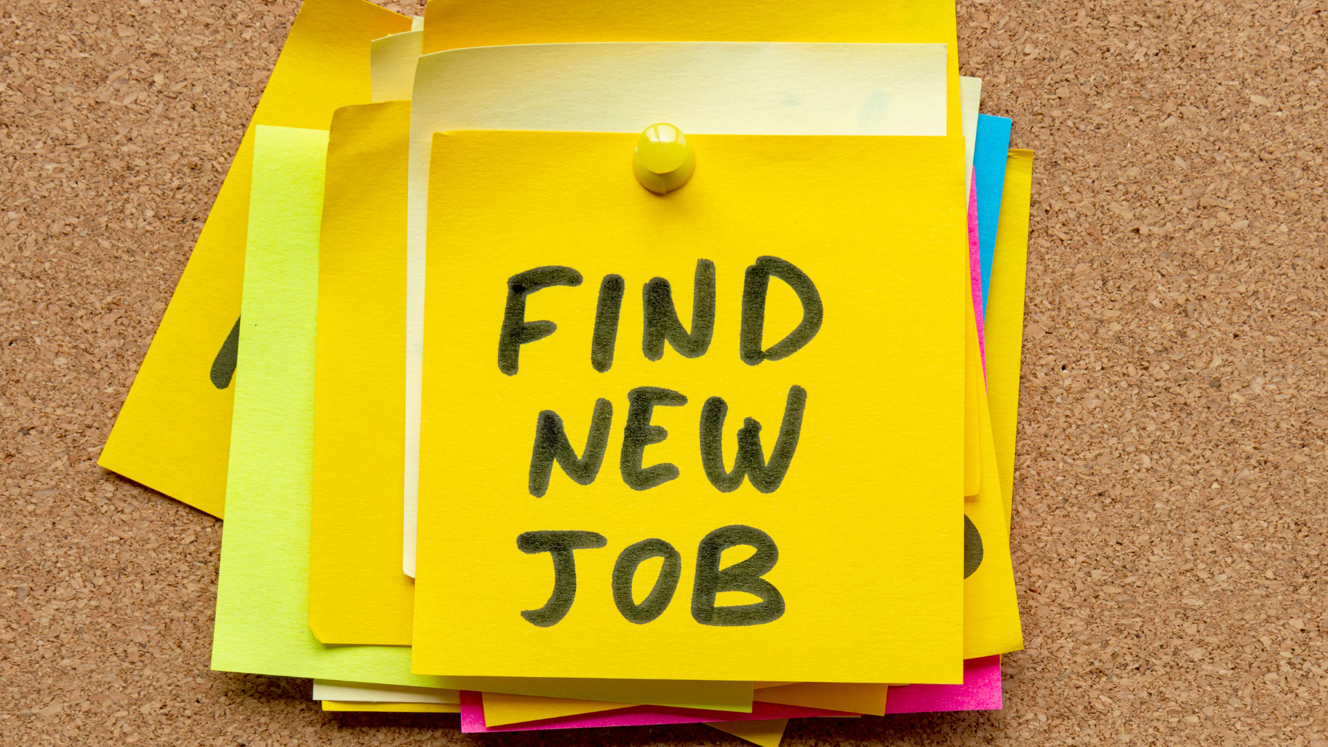 A stack of yellow sticky notes with the words `` find new job '' written on them.