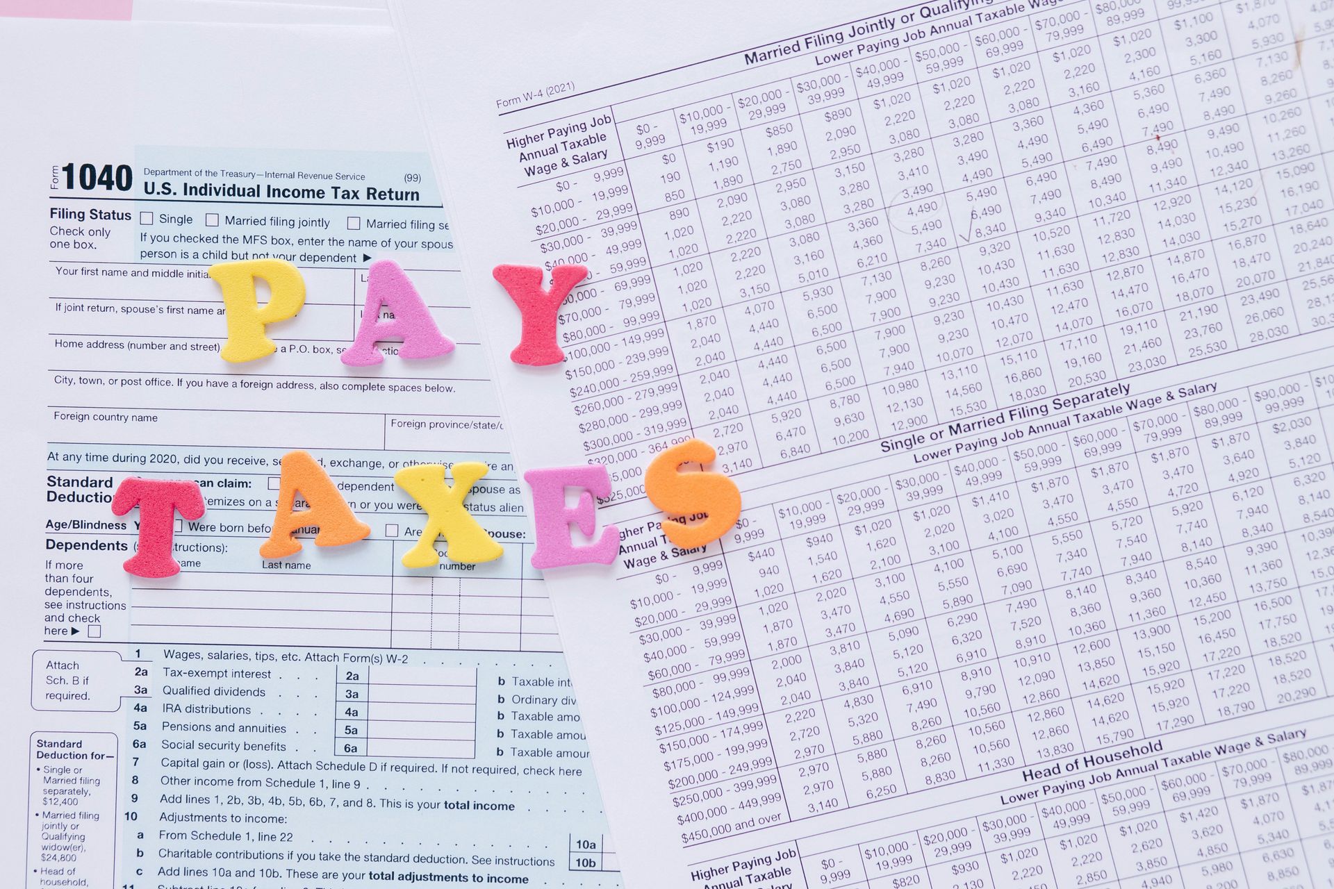 1040 tax form with colorful letters spelling 