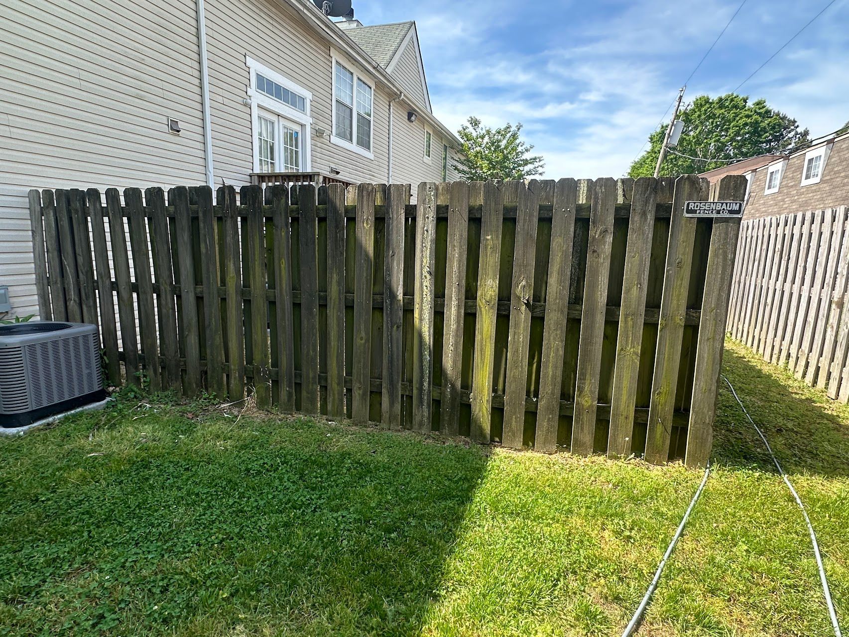 A before photo of a fence cleaning job in Gloucester, VA