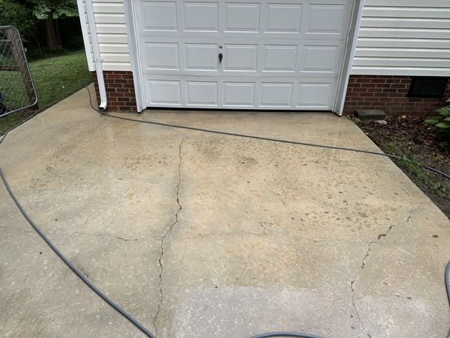A after photo of a concrete driveway pressure washing job in Gloucester, VA
