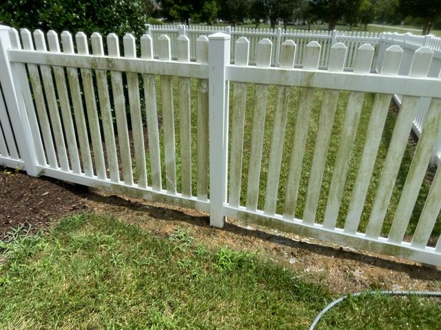 A before photo of a fence cleaning job in Gloucester, VA