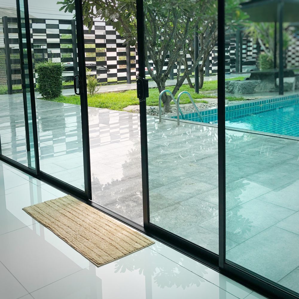 Glass Doors Open to a Pool — Local Glassmaster in Huskisson, NSW