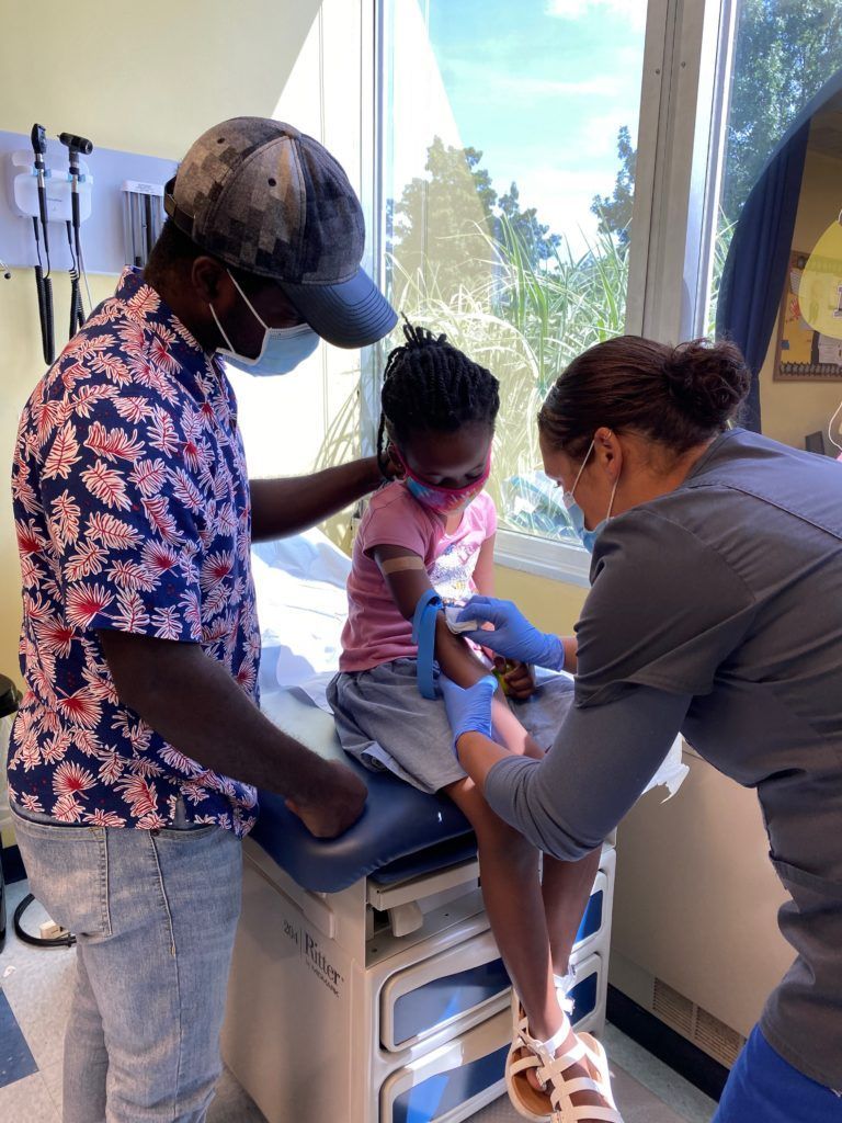 Child receiving health care services
